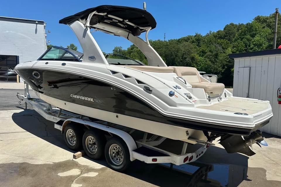 2012 Chaparral 284 Sunesta boat on trailer, parked outdoors.