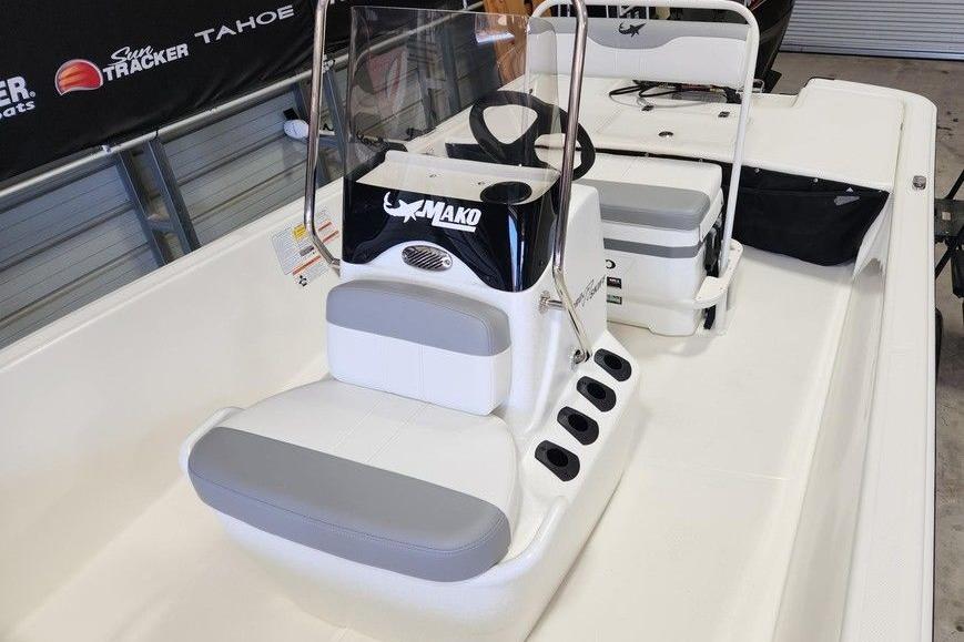 2026 Mako Pro Skiff 17 CC boat interior with seating and steering console.