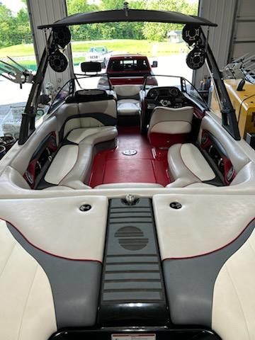 Interior view of a 2009 Malibu Wakesetter 23 LSV with red and white seating.