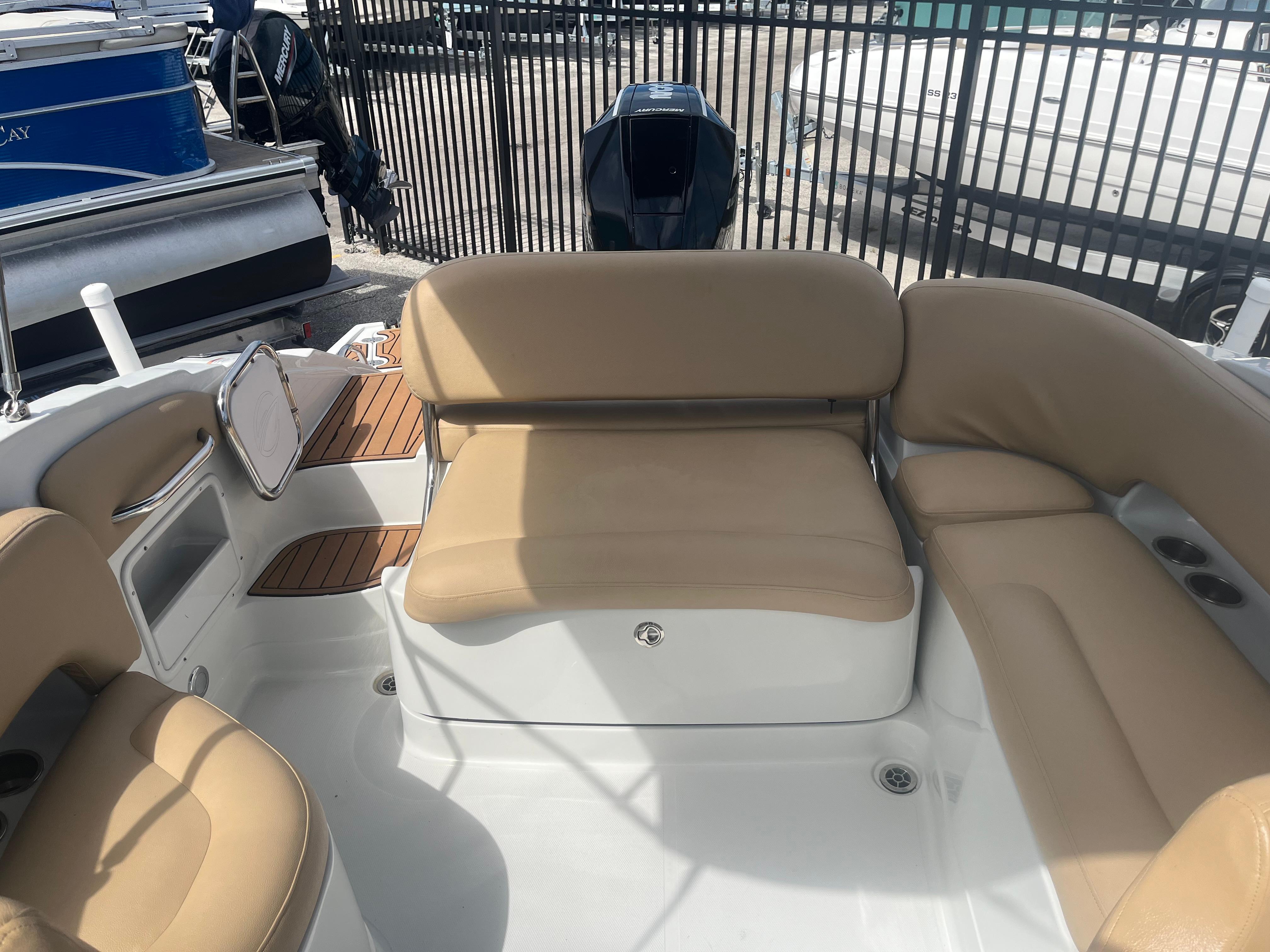 2022 Crownline Eclipse E235 XS boat interior with tan seating and white deck.
