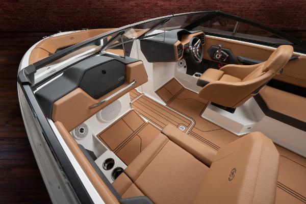 2025 Cobalt CS23 boat interior with luxurious tan leather seating and modern dashboard design.