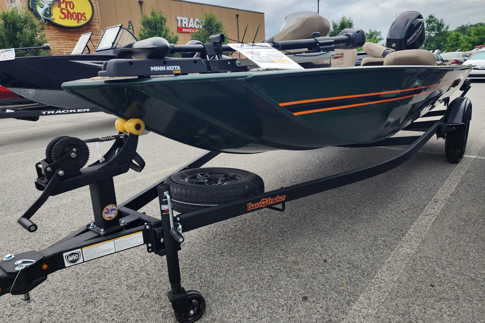 2026 Tracker Bass Tracker Classic Limited boat on trailer at Pro Shops parking lot.