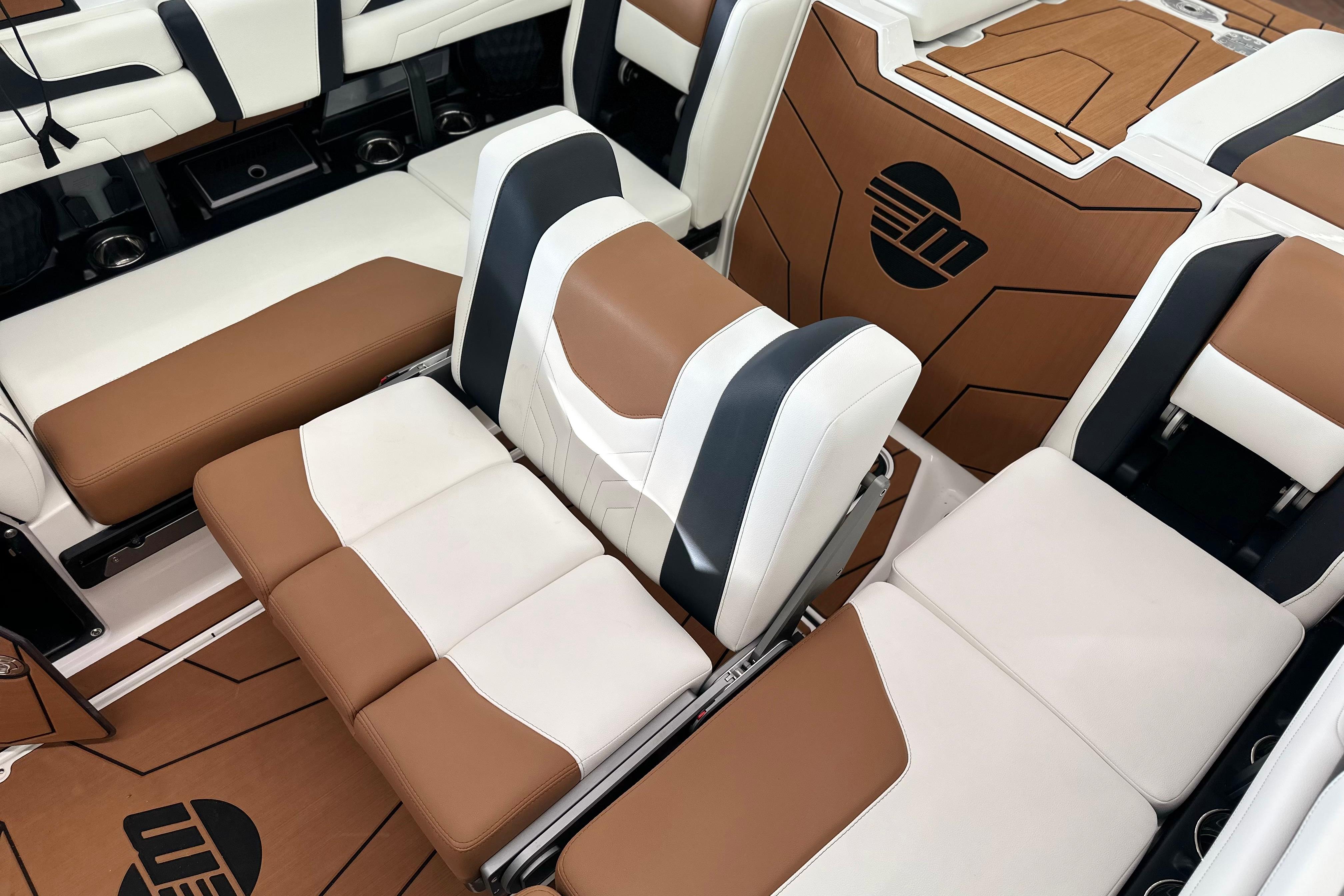 2026 Malibu Wakesetter 25 LSV interior with luxurious brown and white seating.