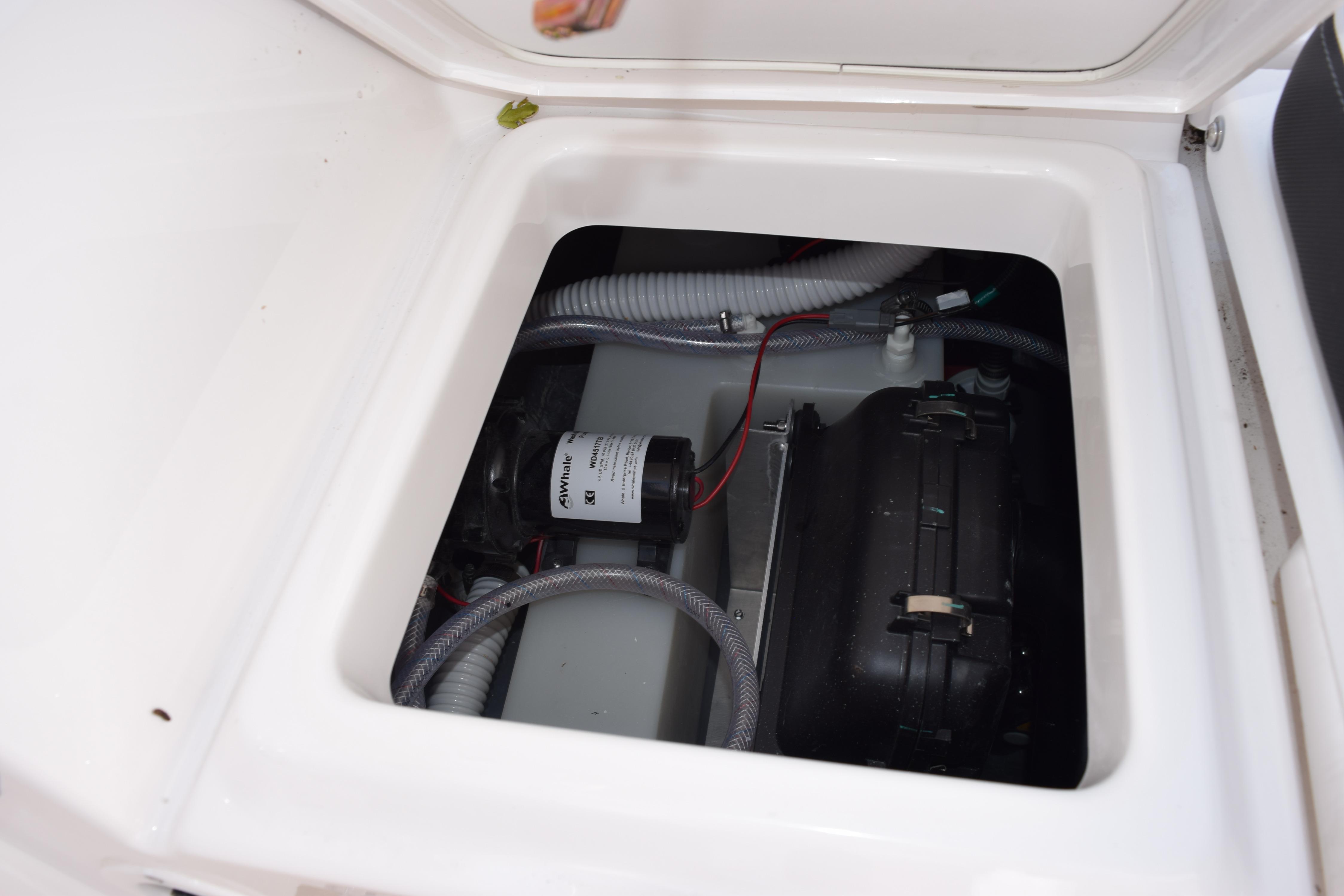 2026 Yamaha Boats 255 FSH Sport H engine compartment with visible wiring and components.