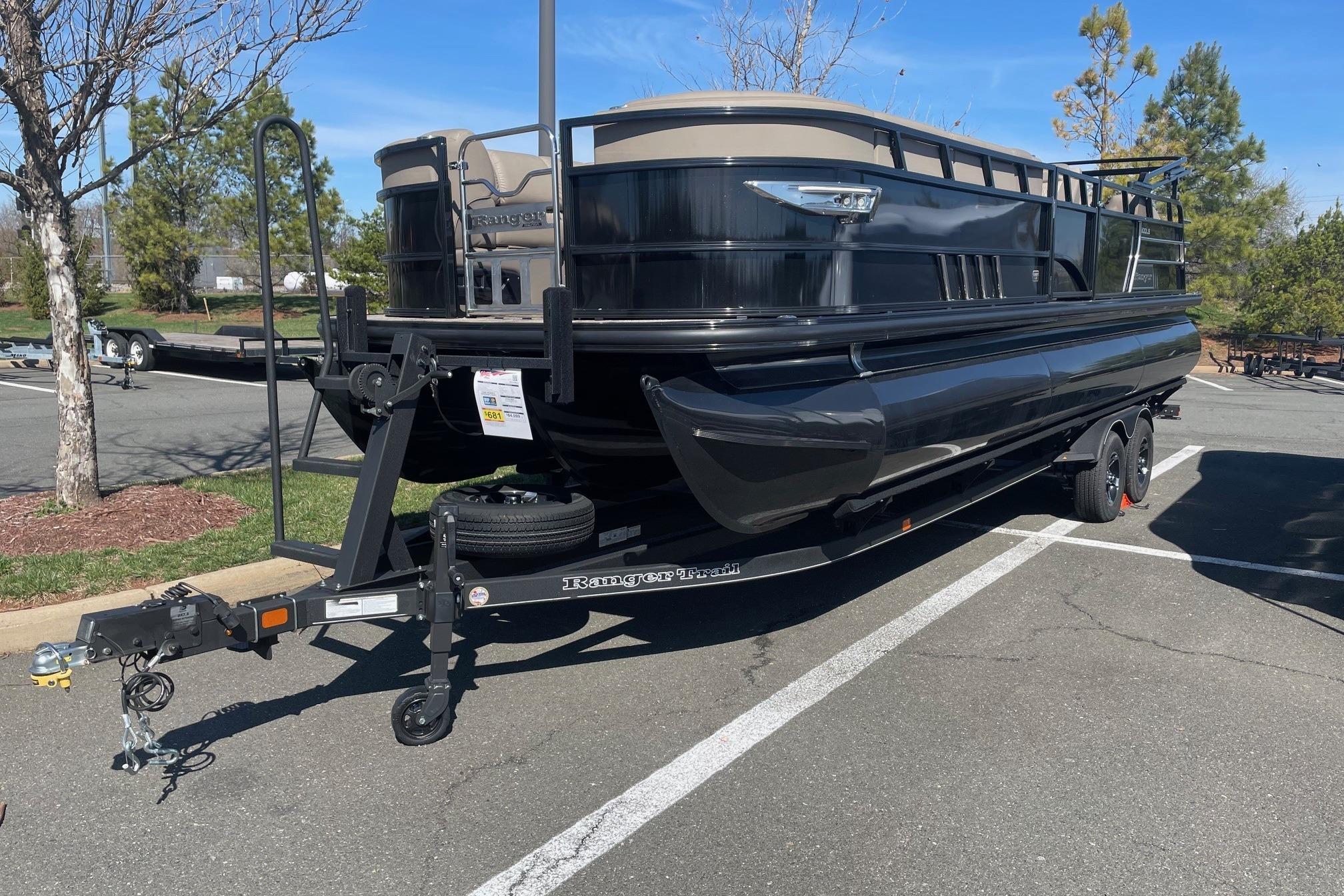 2024 Ranger 2500LS pontoon boat on trailer in parking lot, sunny day.