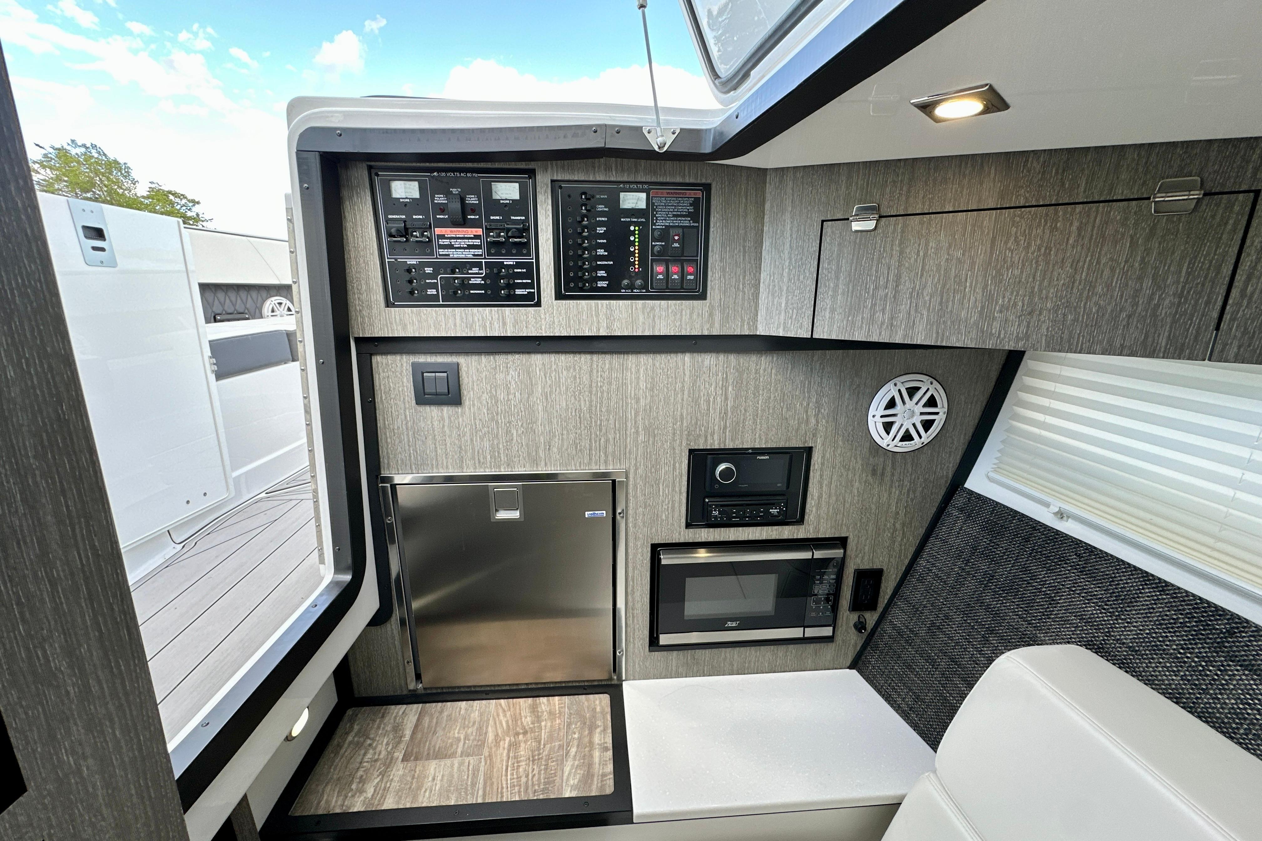 Interior of 2022 Monterey 378SS Super Sport boat with modern appliances and control panels.