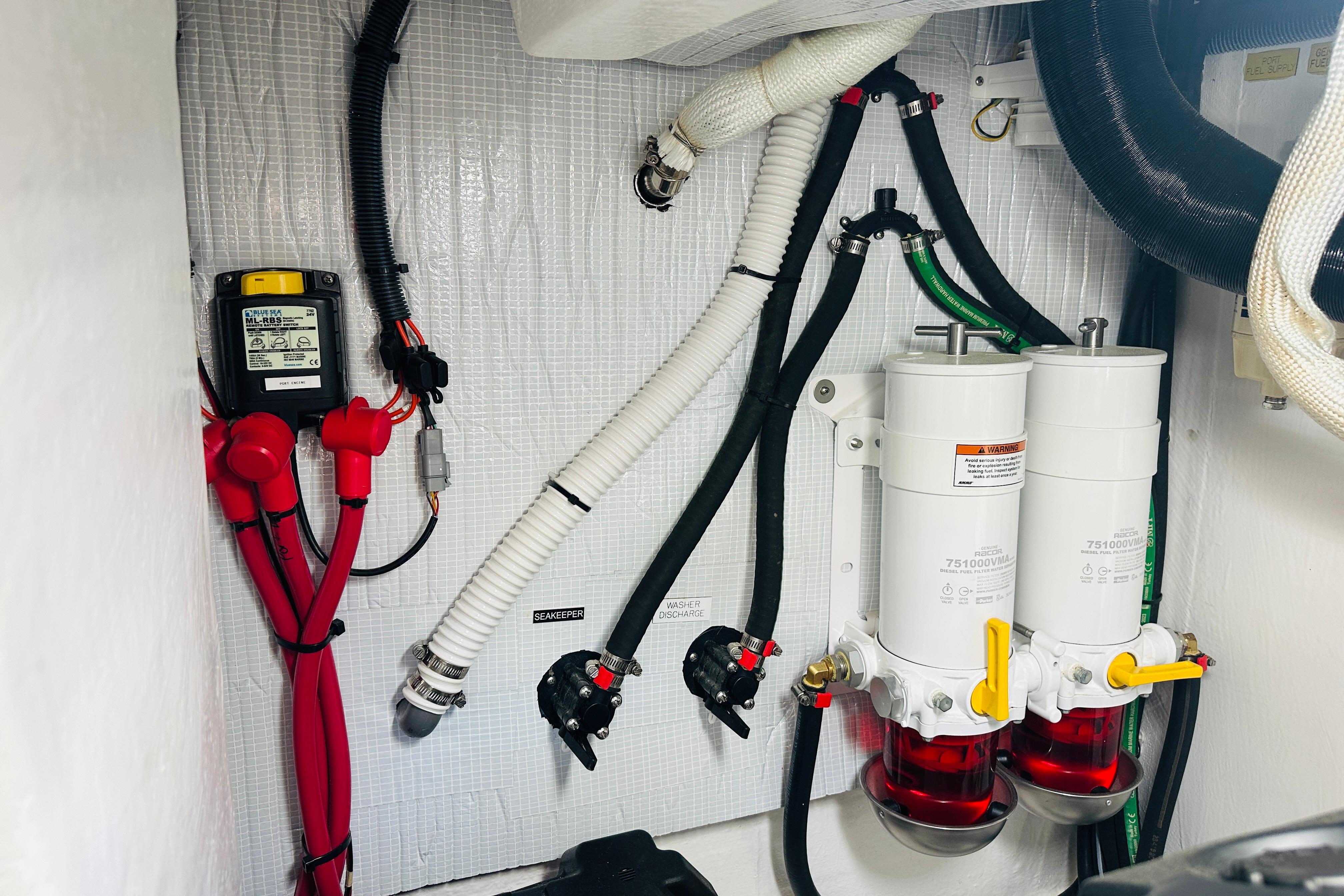 Engine room of 2025 Sabre 48 Salon Express with fuel filters and wiring.