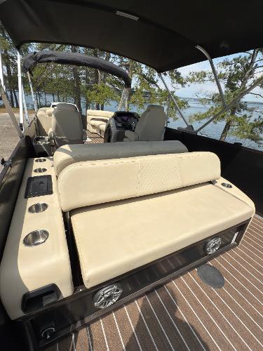 2022 Premier 250 Solaris boat with beige seating and lake view.