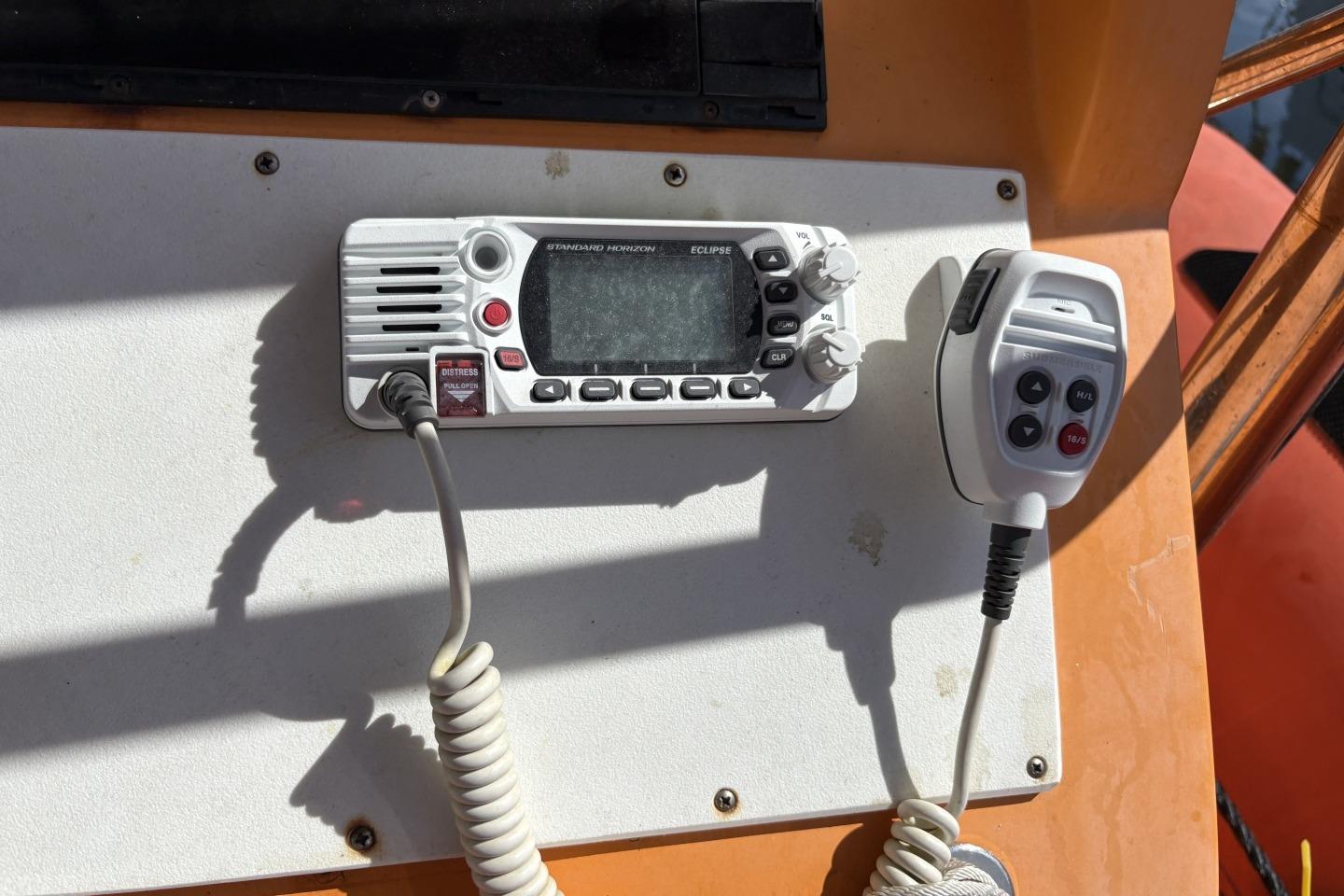 VHF radio system on Parker 1000 Baltic boat, 2018 model, with microphone attached.