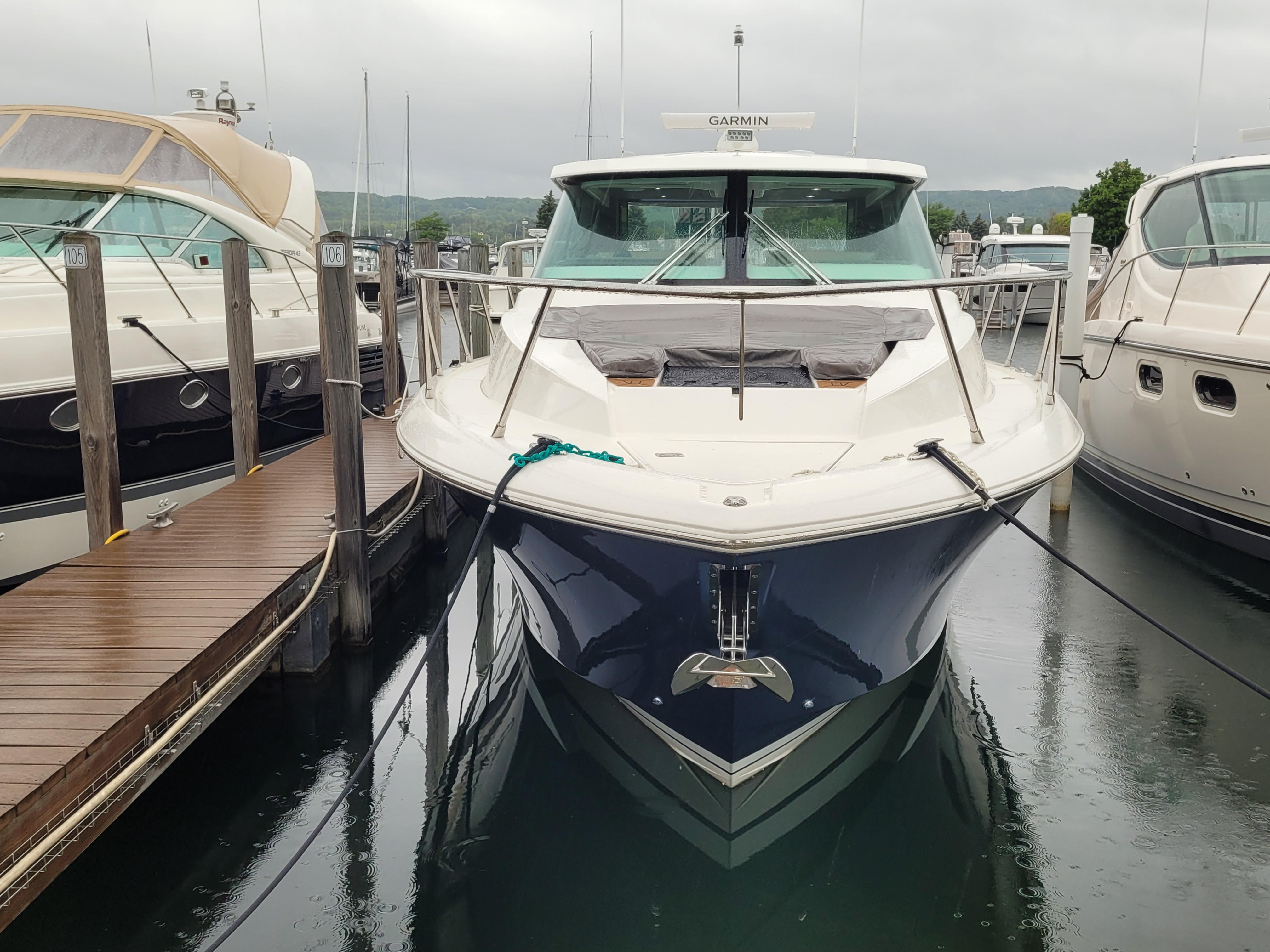 2021 Tiara Sport 43LE yacht docked at marina, front view.