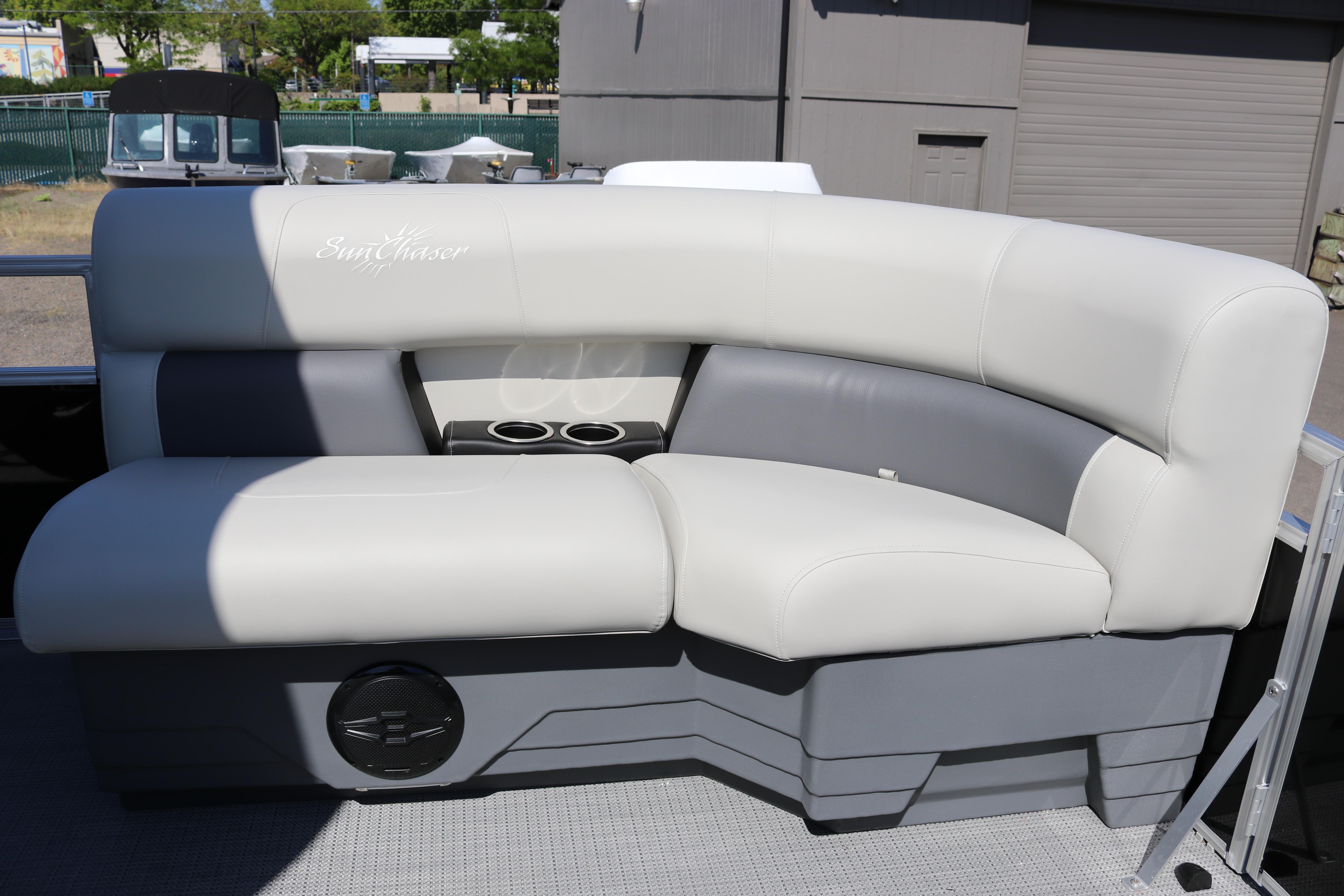 Luxurious seating on 2025 SunChaser Vista 20 Fish pontoon boat, featuring cup holders.