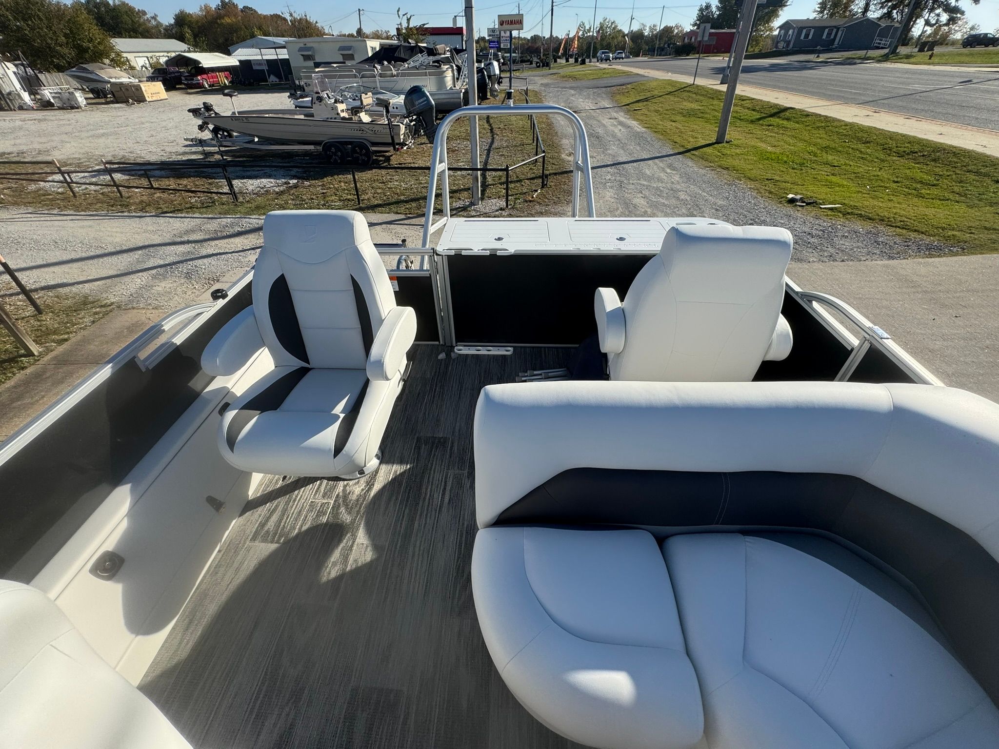 Interior of 2026 Landau 23C Atlantis pontoon boat with white seating.