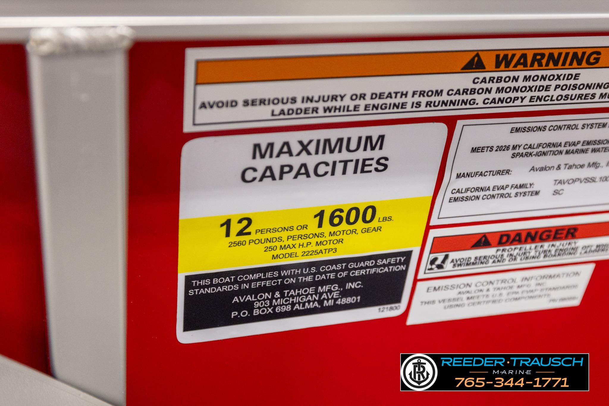 Warning label on 2026 Avalon LSZ QL boat showing maximum capacities and safety information.