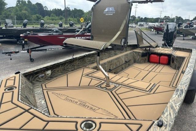2026 Tracker Grizzly 1650 T Prairie Wings Edition boat with camo design and seating.
