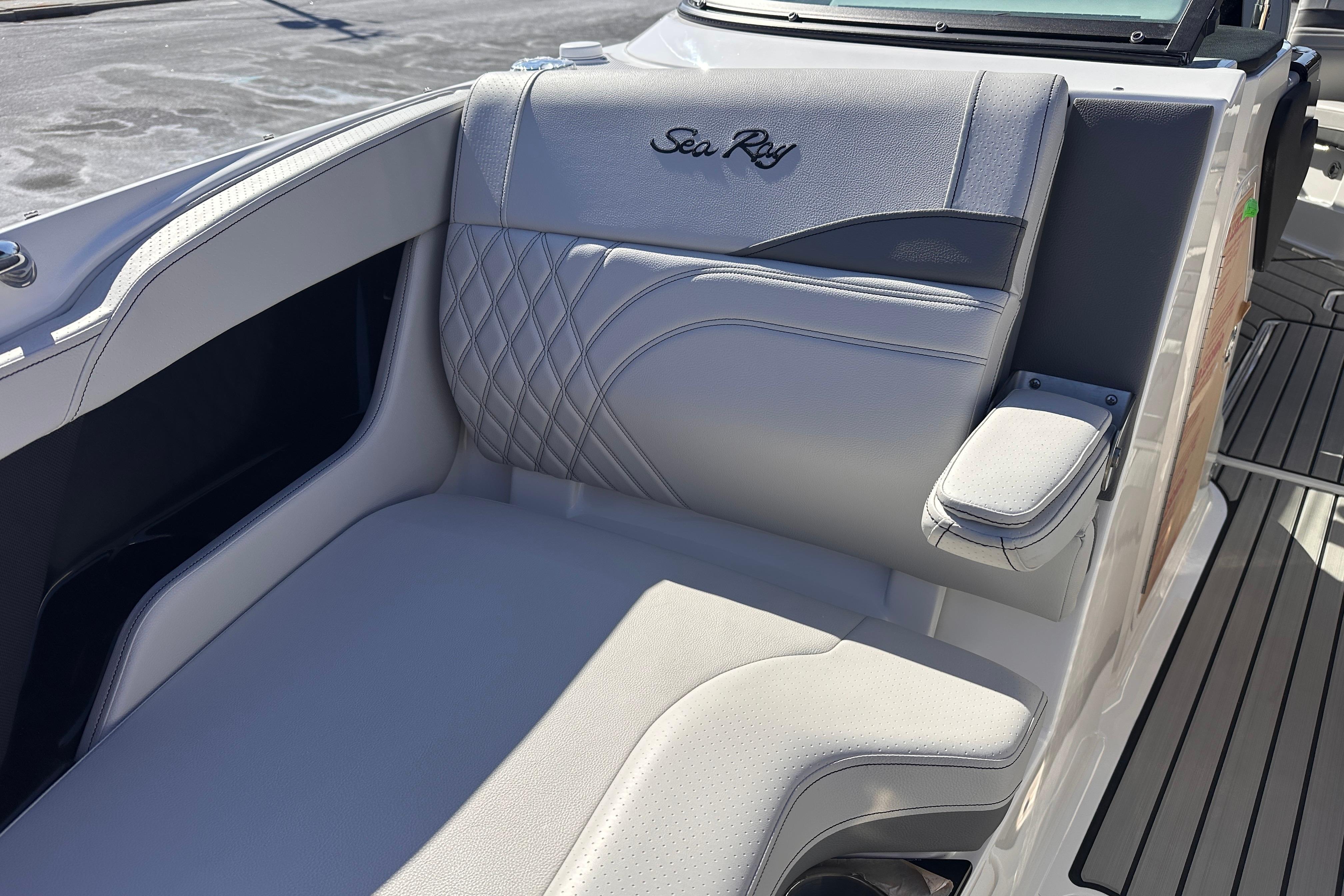 2026 Sea Ray SLX 260 Outboard boat seat with elegant stitching and armrest.