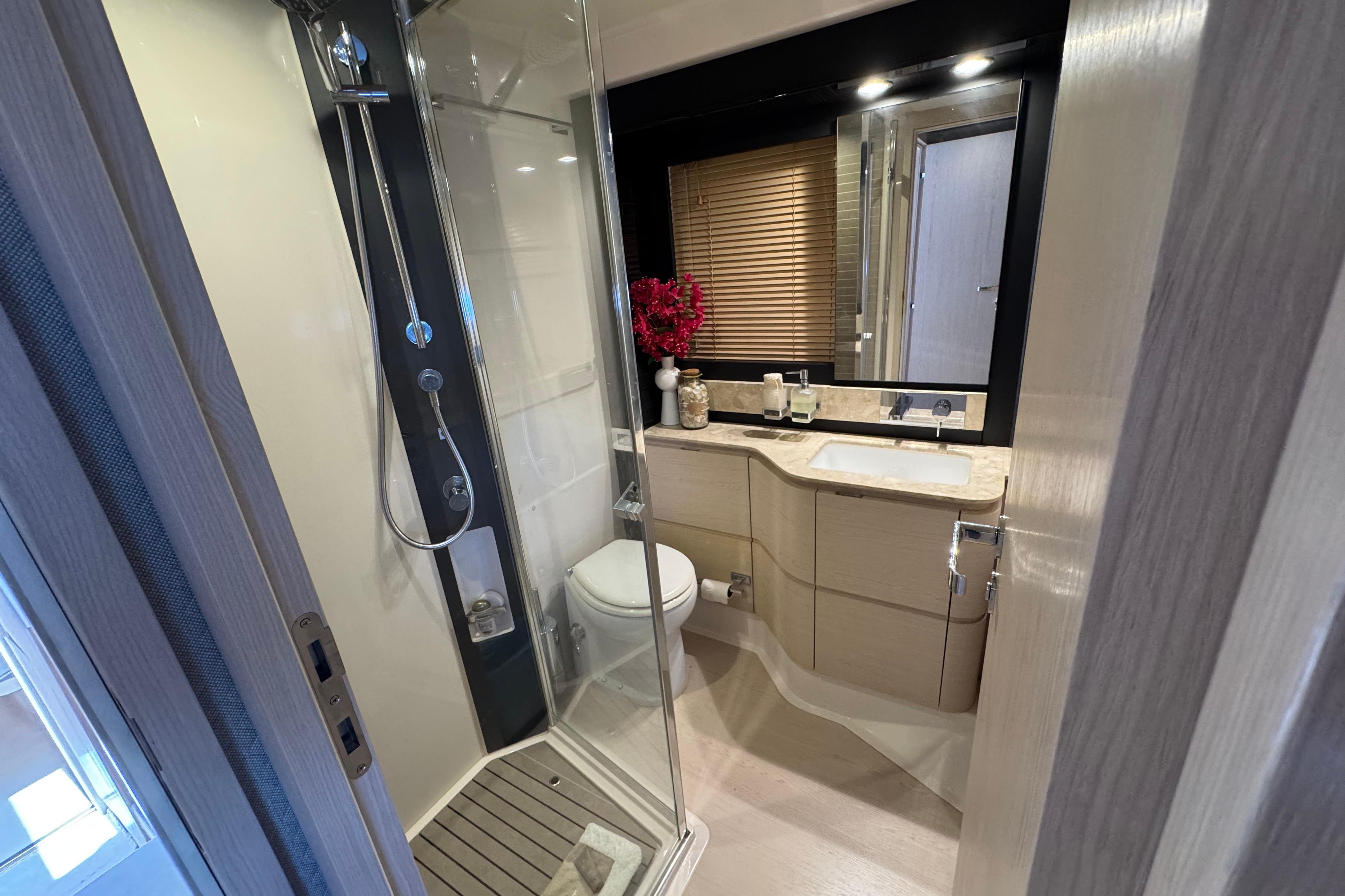 Luxurious bathroom in 2018 Azimut 66 Flybridge yacht with modern fixtures and elegant design.