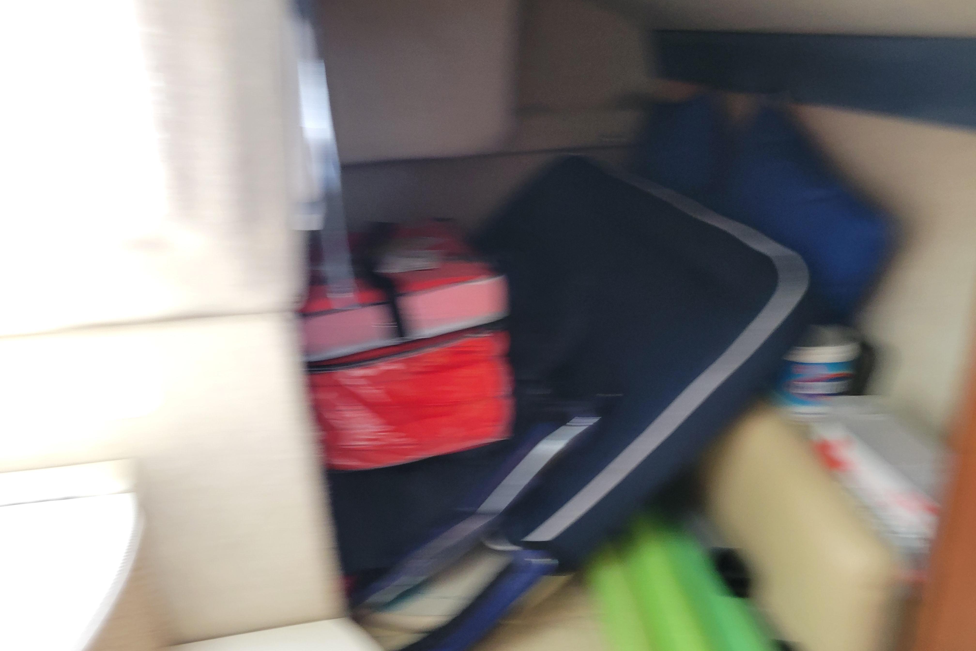 Interior of a 2007 Bayliner 245 Cruiser with stored items and equipment.
