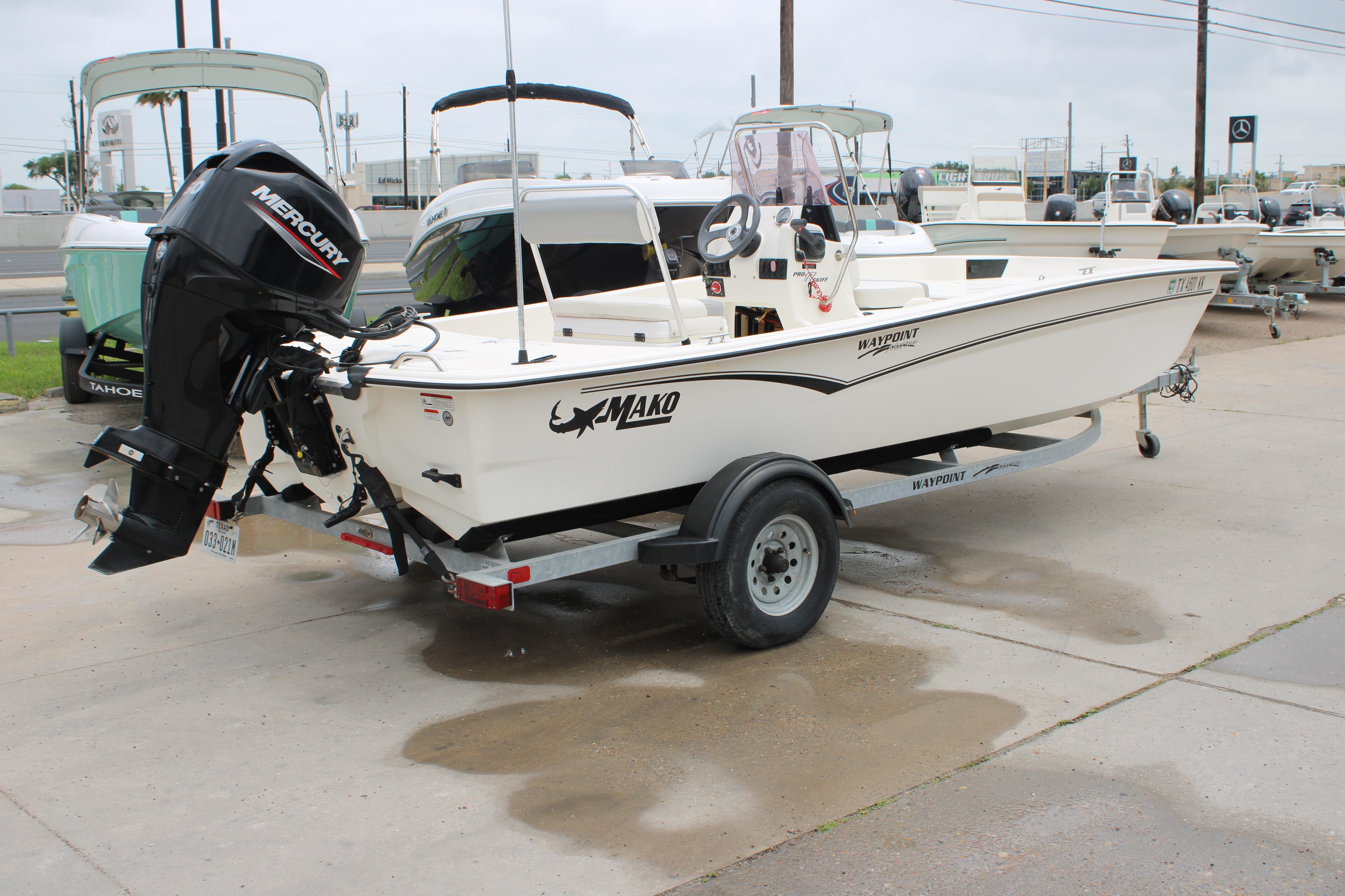 2021 Mako Pro Skiff 17 CC boat on trailer with Mercury outboard motor.
