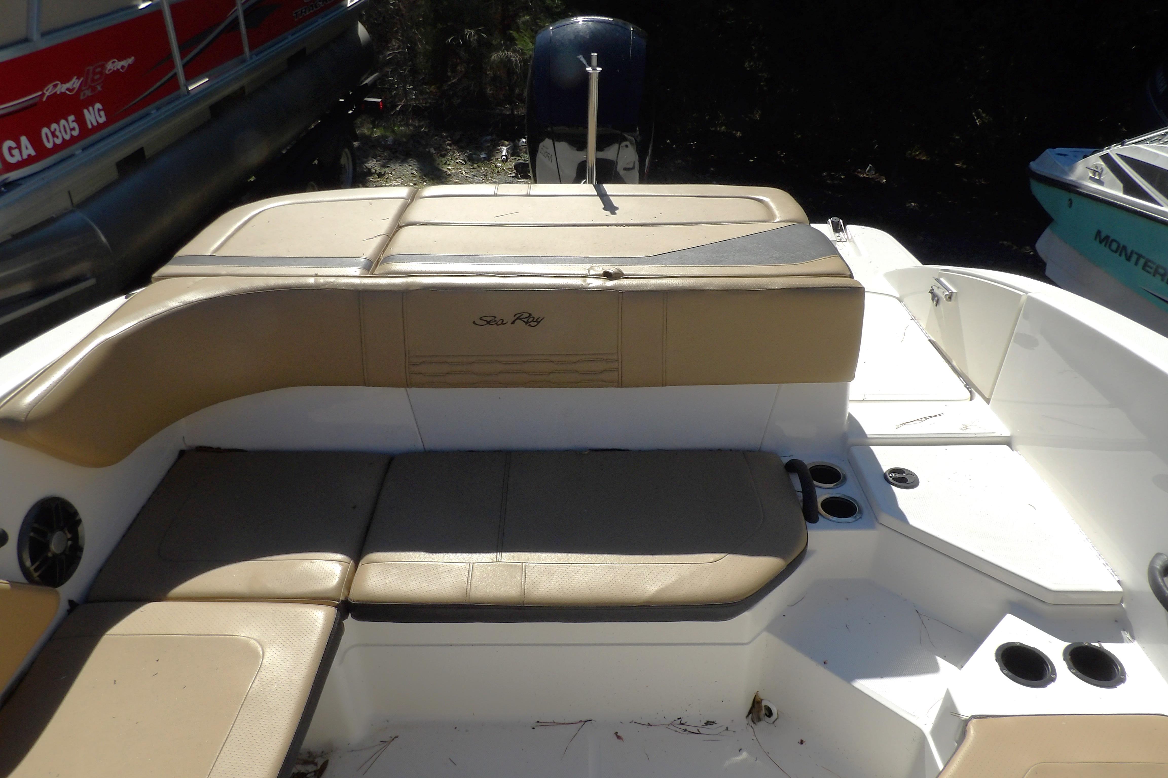 2023 Searay 210 SPO boat interior with tan seating and cup holders.