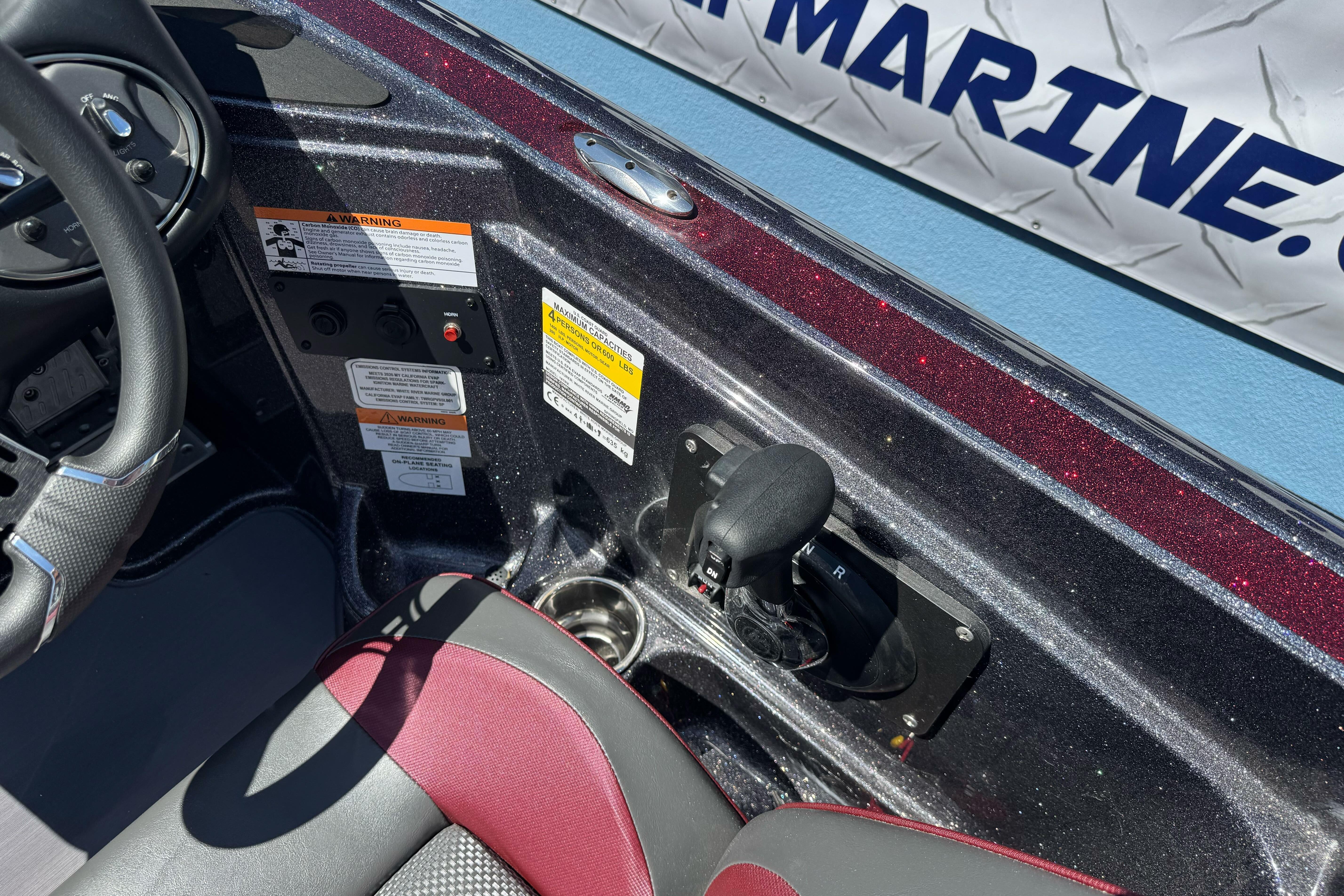 Interior of a 2026 Triton 18 TrX boat showing steering wheel and controls.