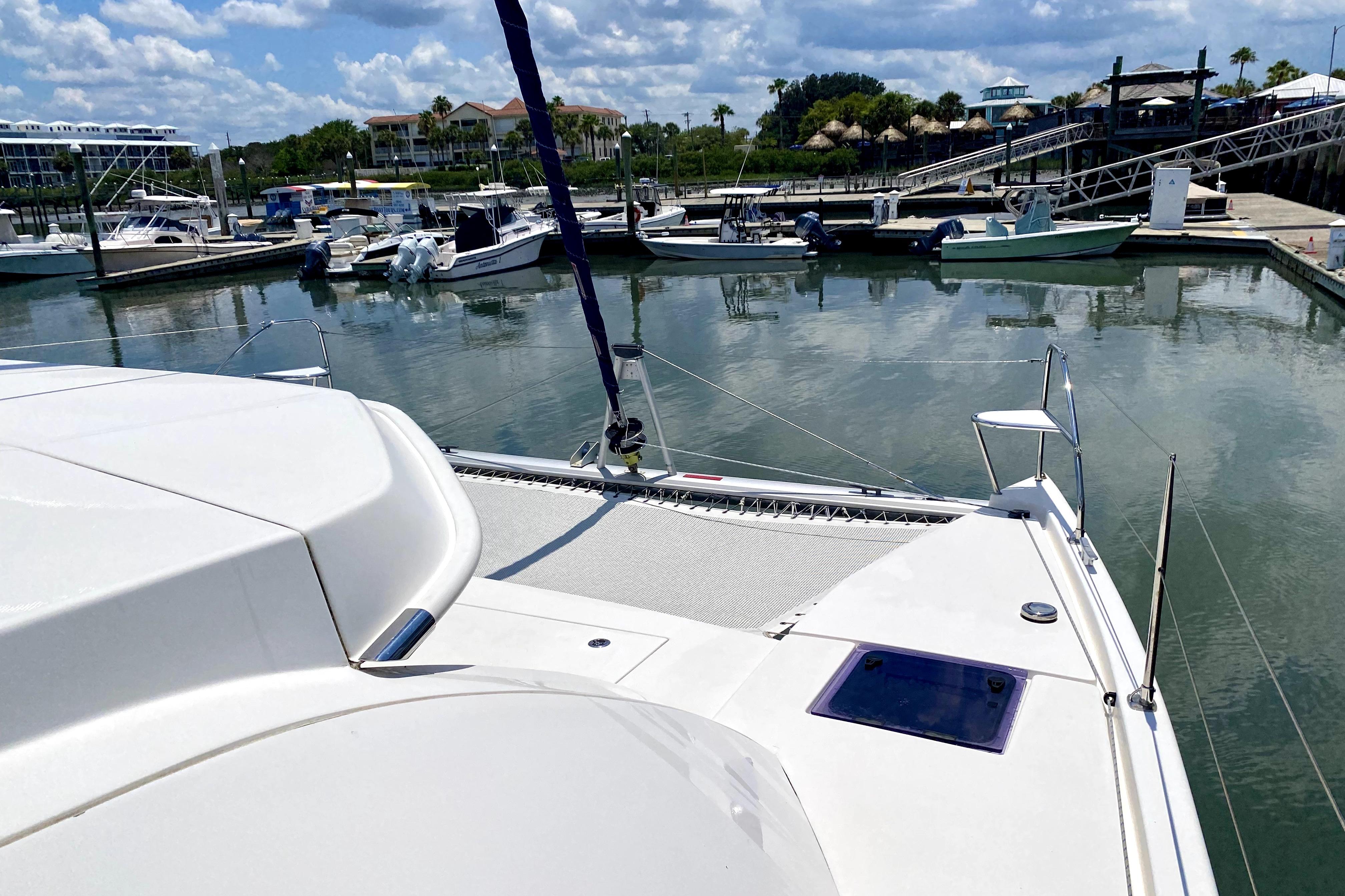 2017 Leopard 40 catamaran docked at a marina with clear skies.