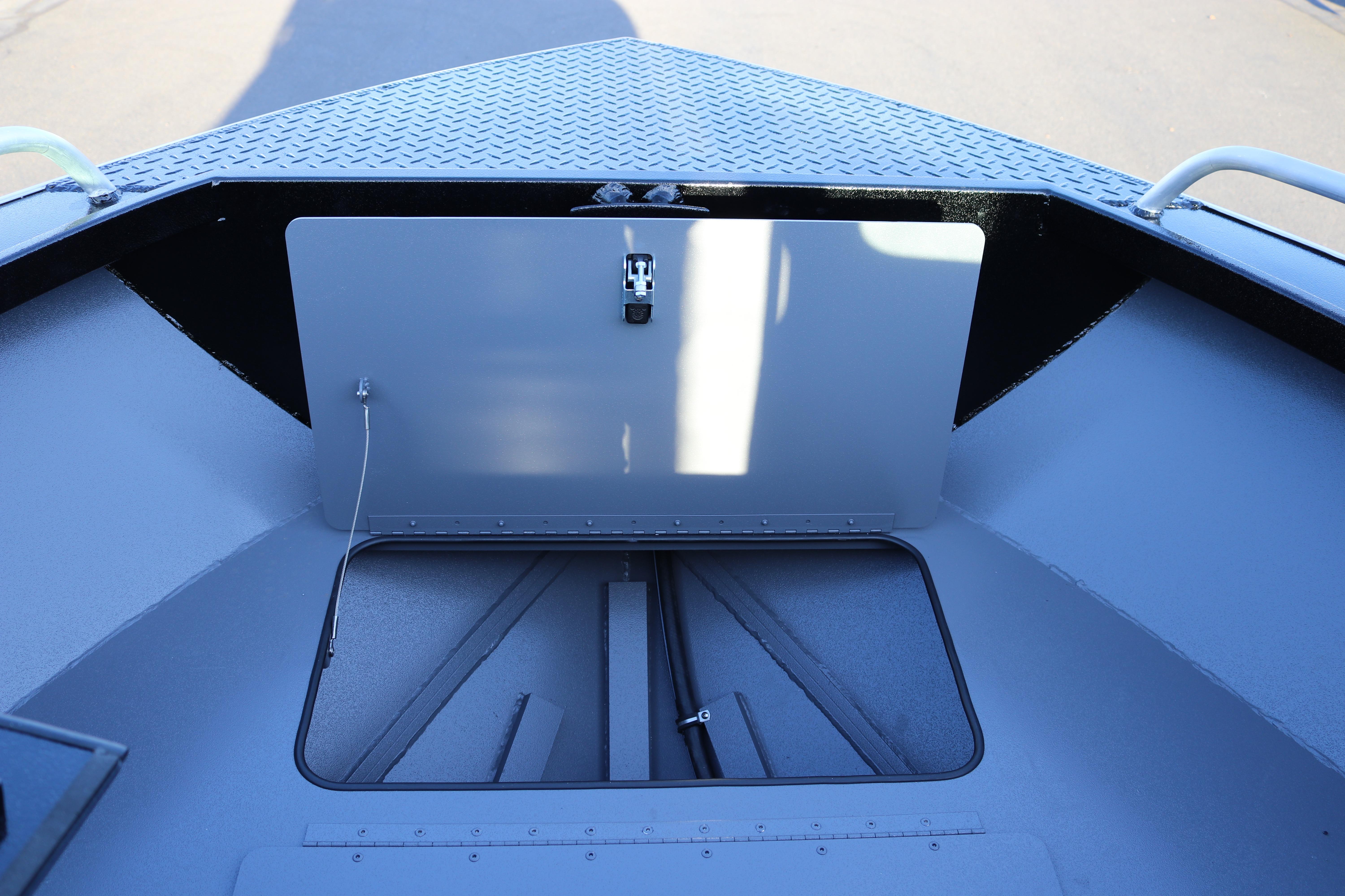 2026 Alumaweld Stryker X202 boat storage compartment with open hatch and diamond plate flooring.