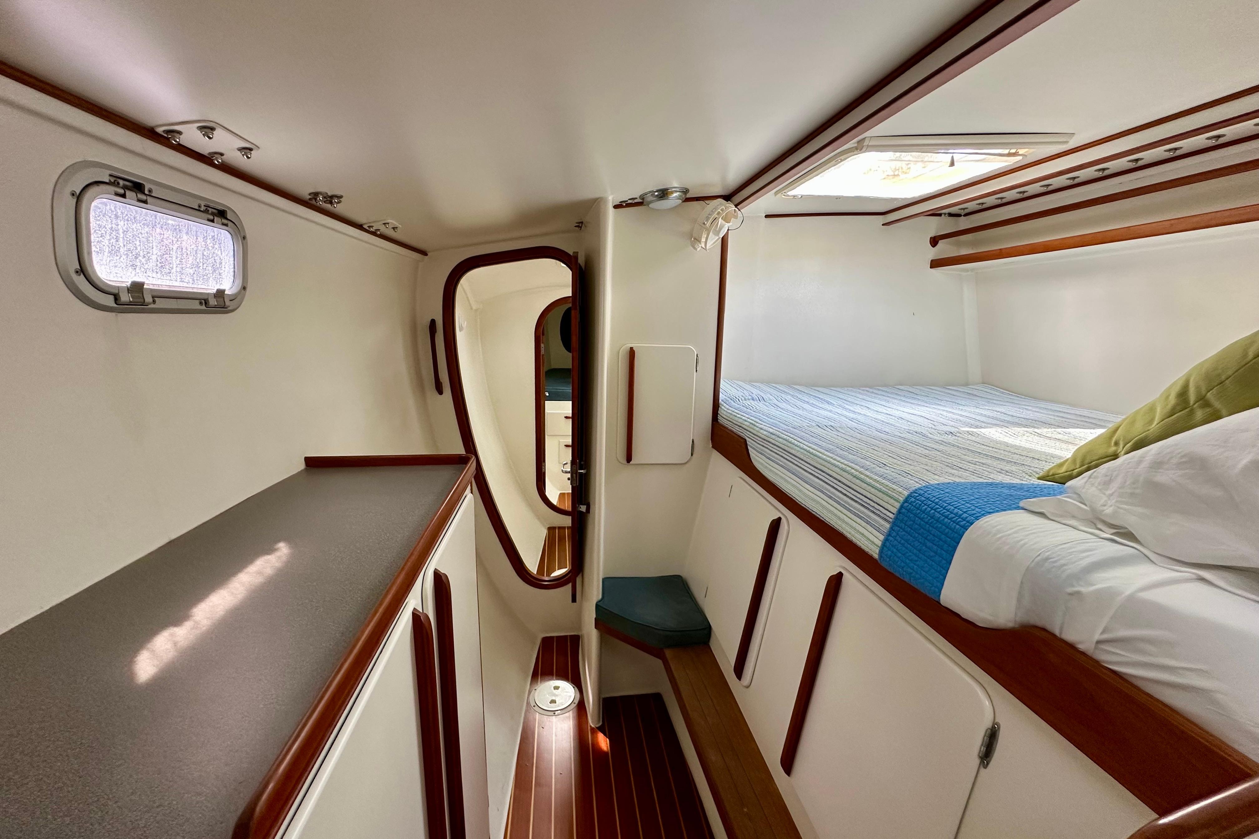 Interior cabin of 2003 Chris White Atlantic 42 catamaran with bed and storage.