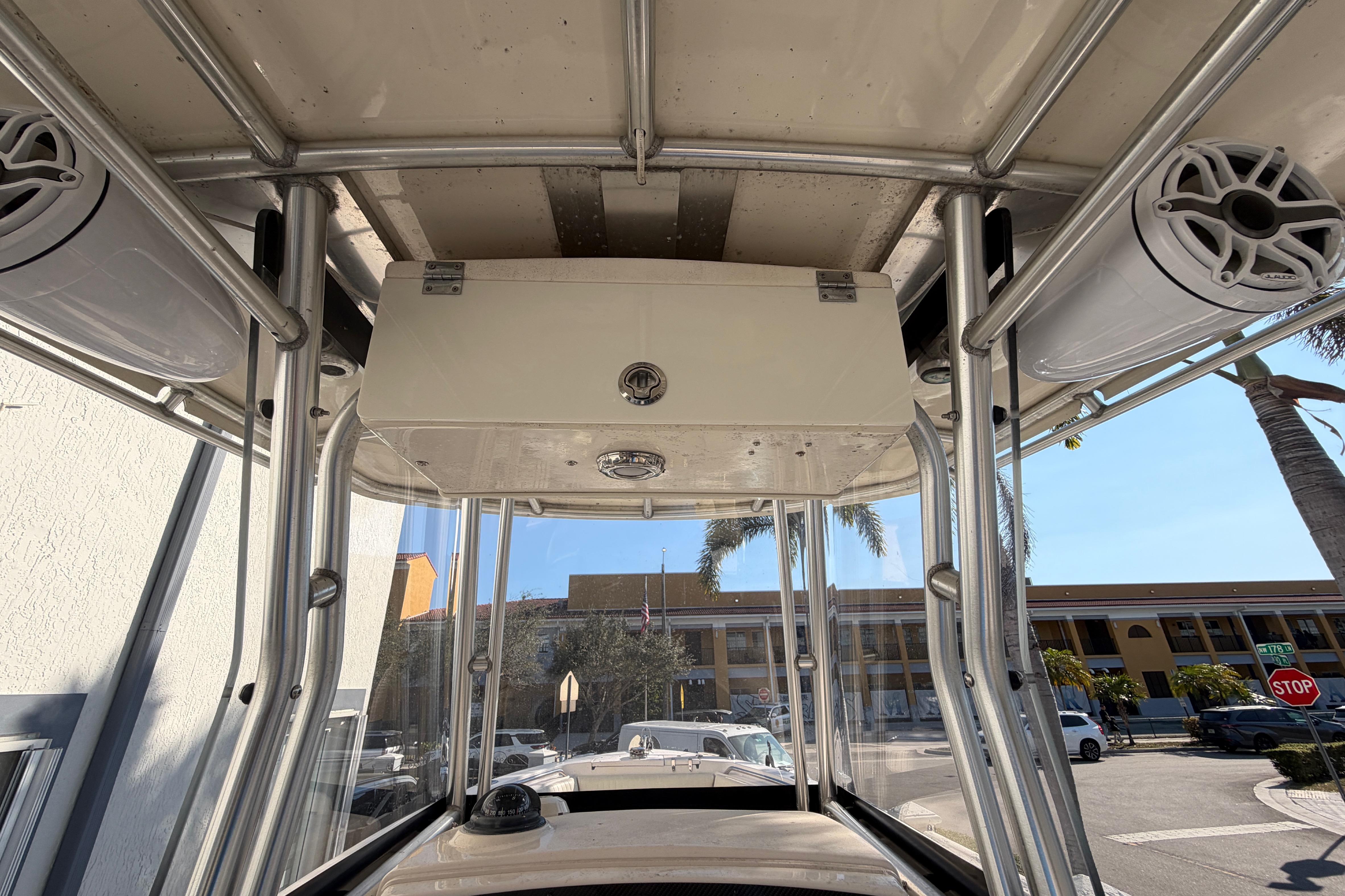 2004 Grady White 273 boat interior with speakers and storage compartment.