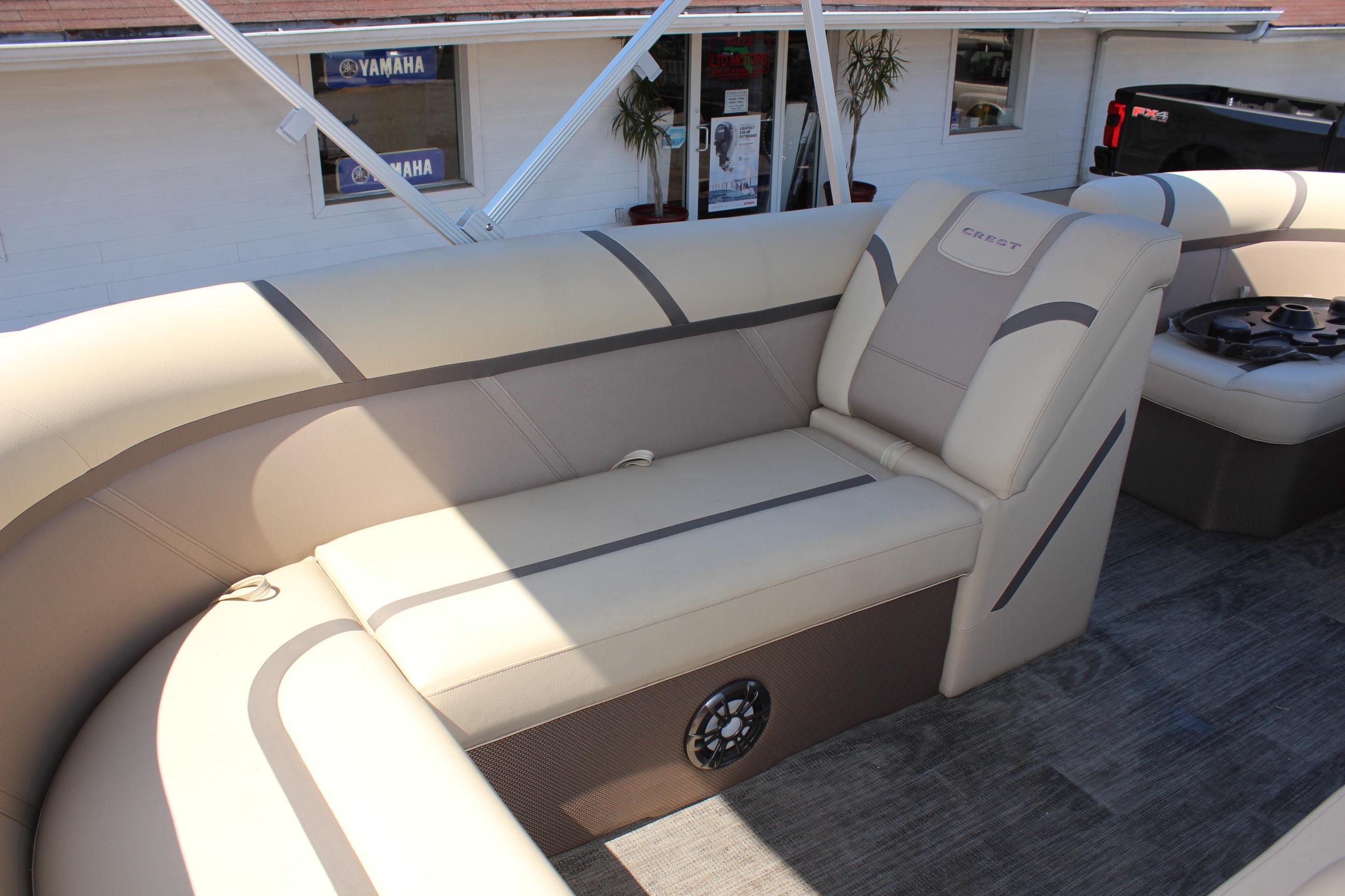 2023 Crest Classic 200 LX L boat interior with beige seating and speaker.