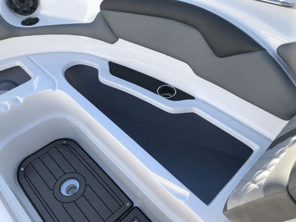 2020 Rinker 29QX BR boat interior with sleek seating and storage compartments.
