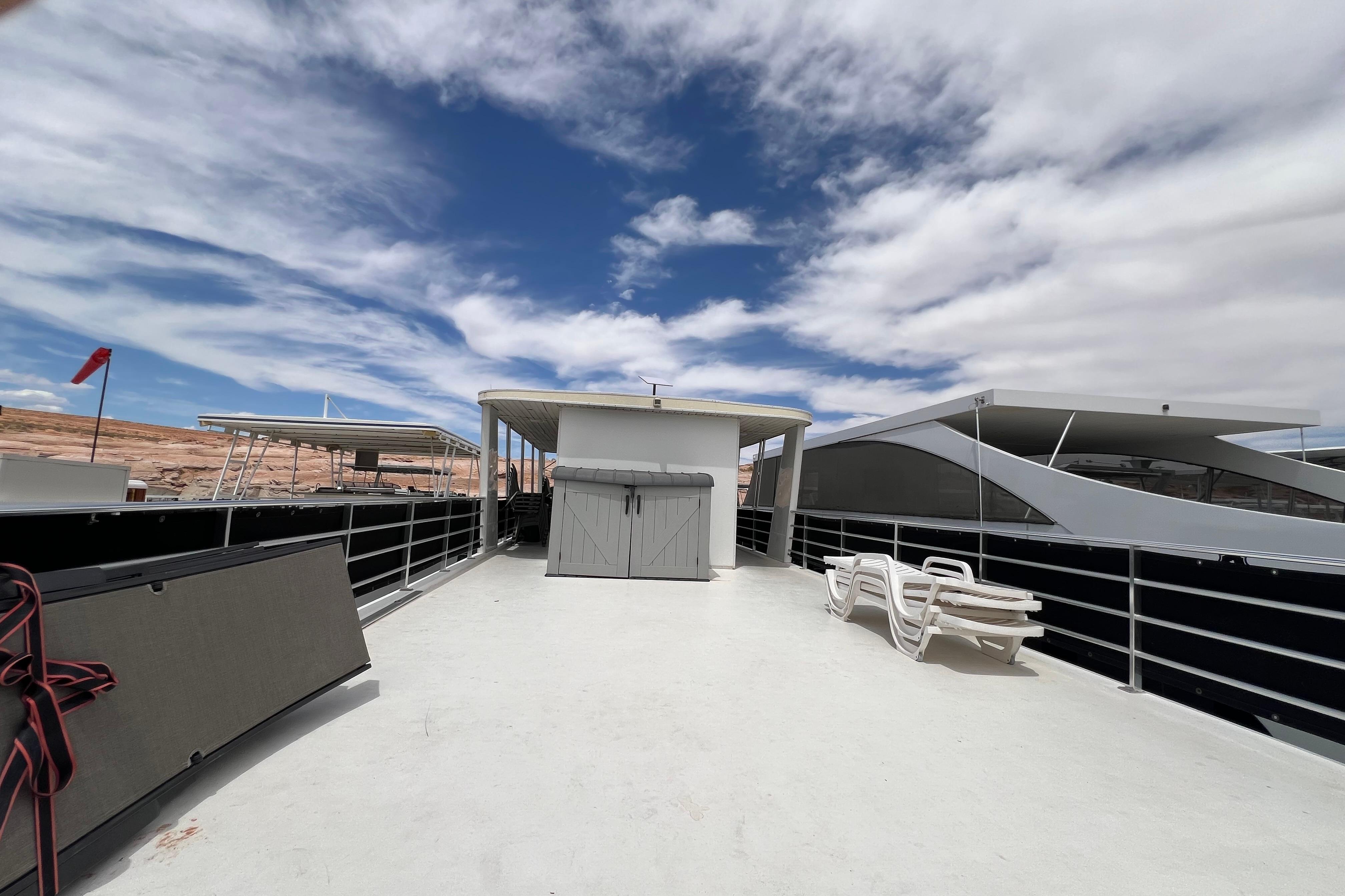 Rooftop deck of 2013 Destination Yacht Lotta Yachta under a partly cloudy sky.