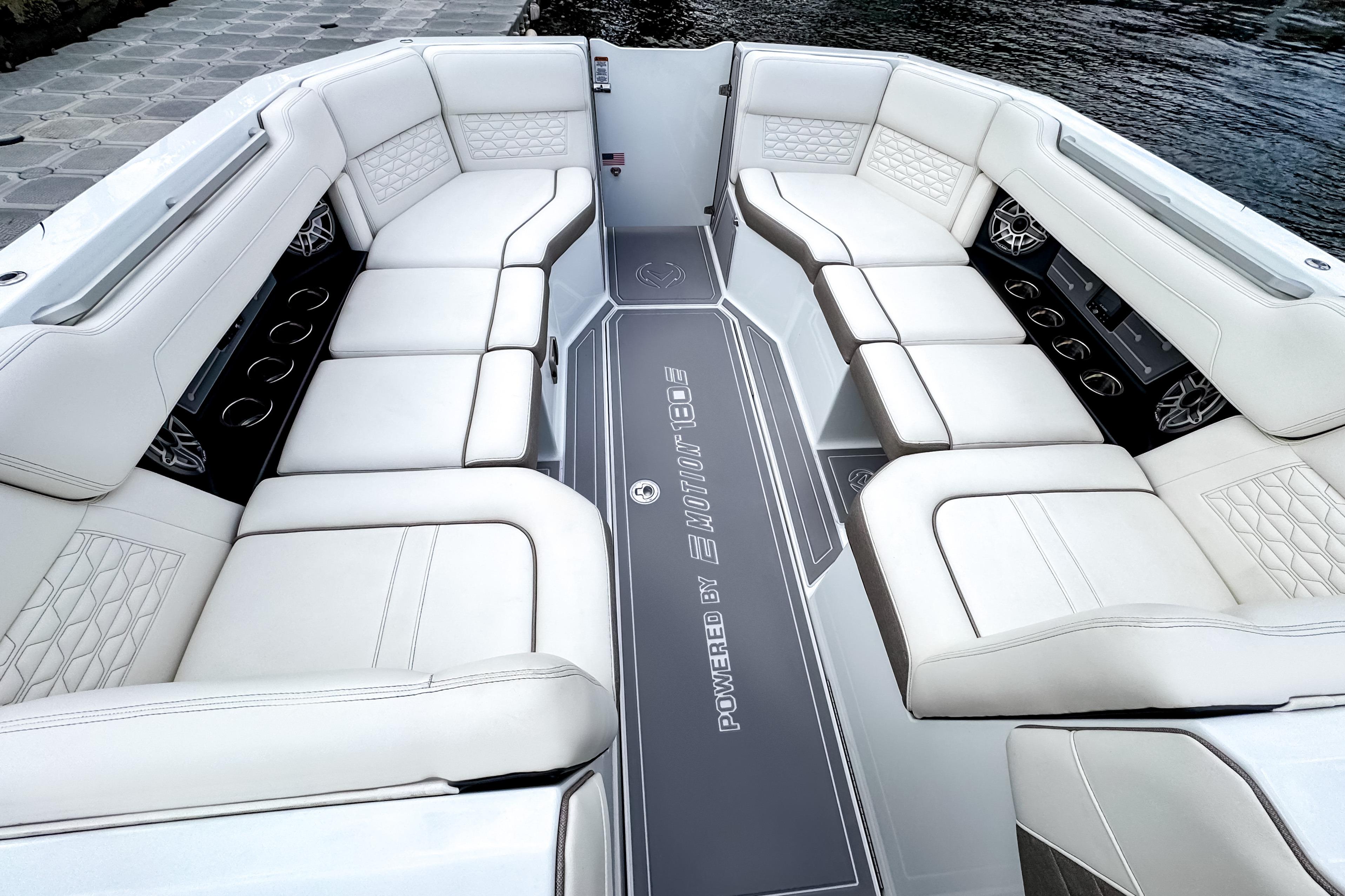 Luxurious seating on 2026 Ingenity EL boat, featuring elegant white upholstery and modern design.