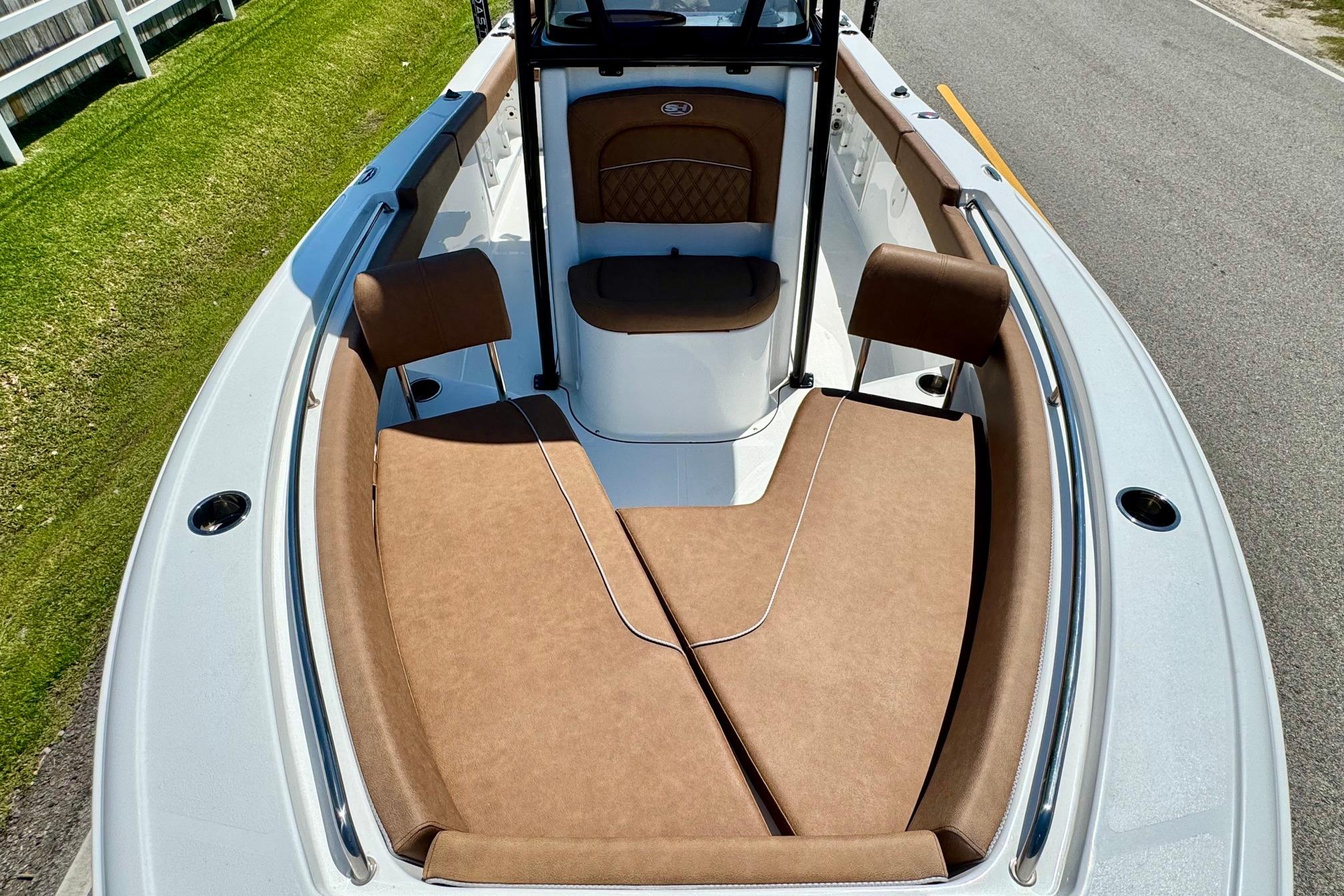 2025 Sea Hunt Ultra 219 boat with brown cushioned seating and sleek design.