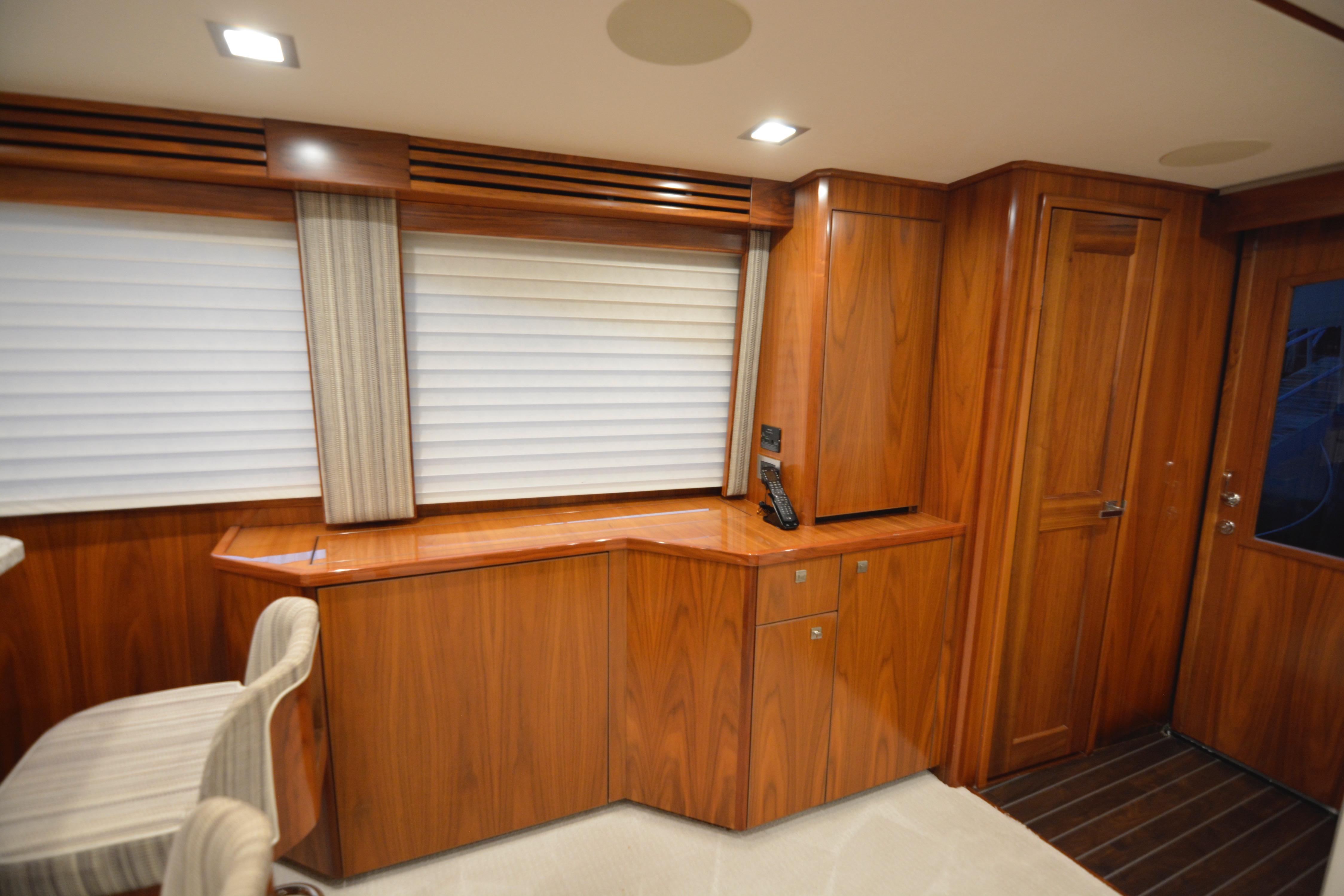 Luxurious interior of 2019 Viking 68 Convertible yacht with elegant wood finish.
