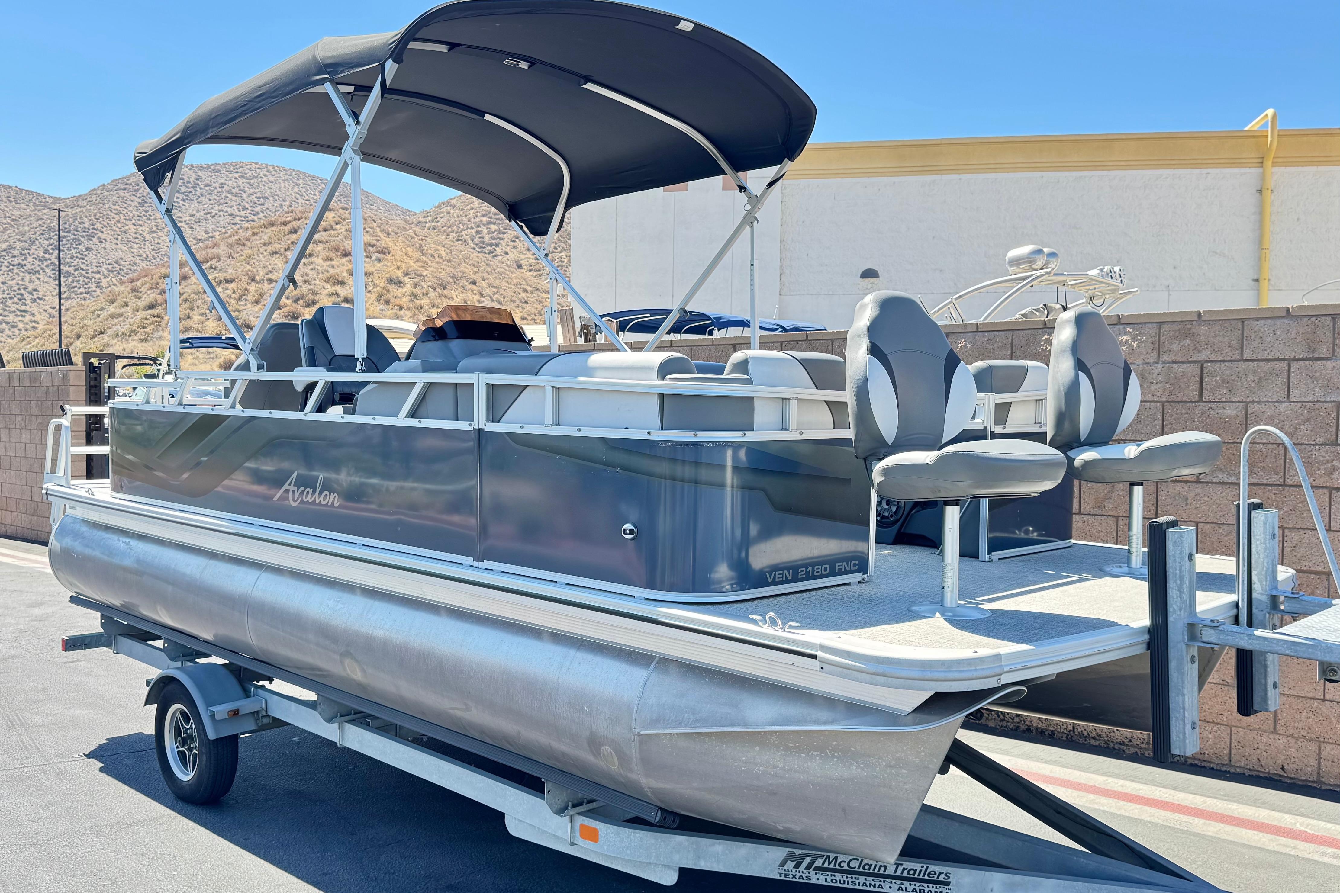2023 Avalon Venture Fish N Cruise 20' pontoon boat on trailer, outdoor setting.