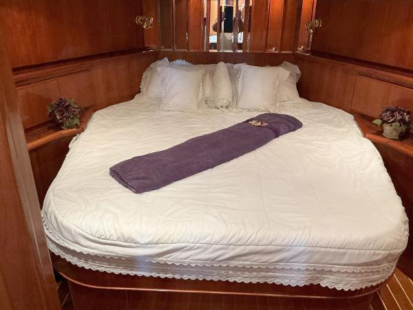 Luxurious bedroom in 2000 Novatec Islander 55 yacht with elegant bedding.