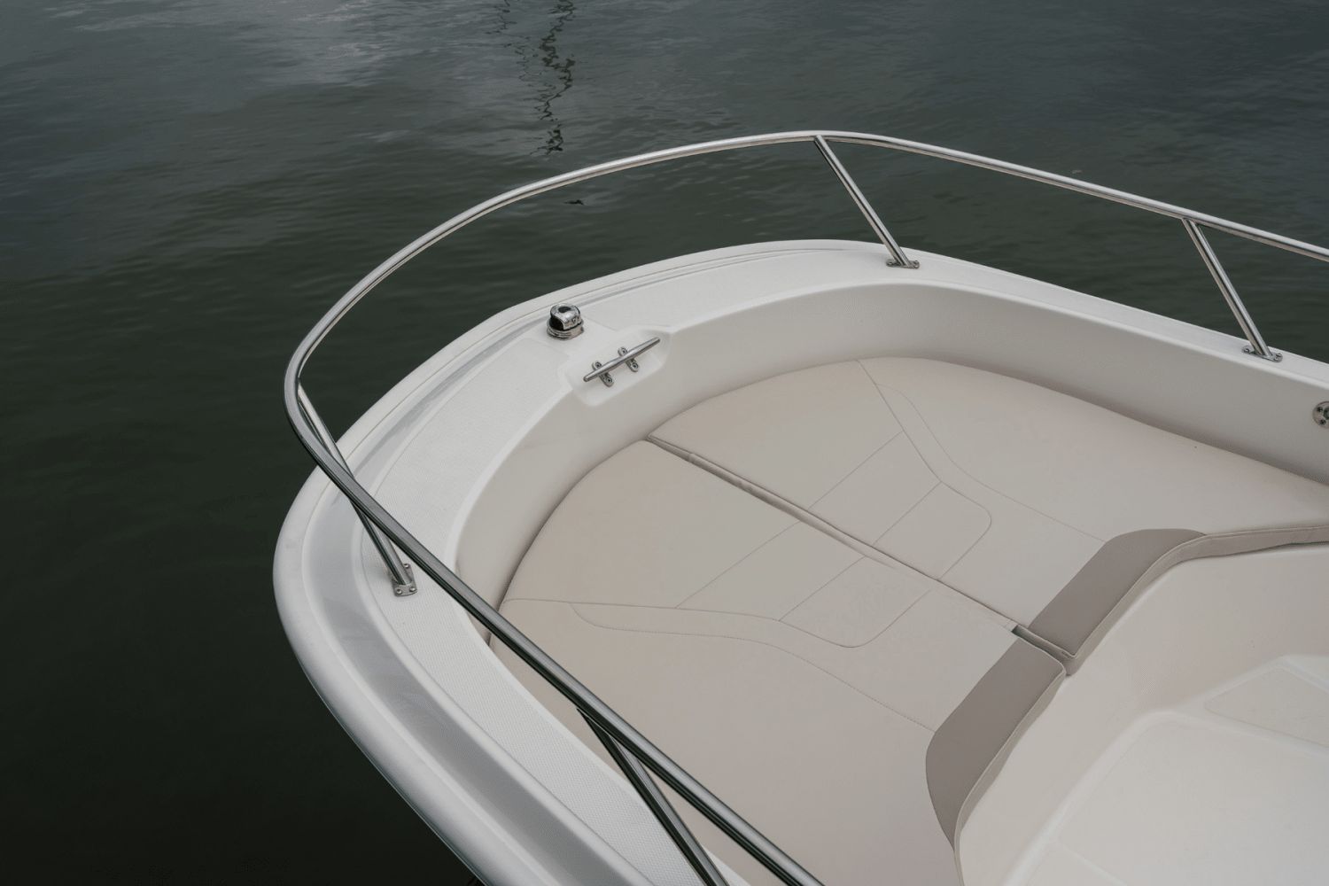 The image shows the bow of a 2026 Boston Whaler 160 Super Sport with sleek upholstery.