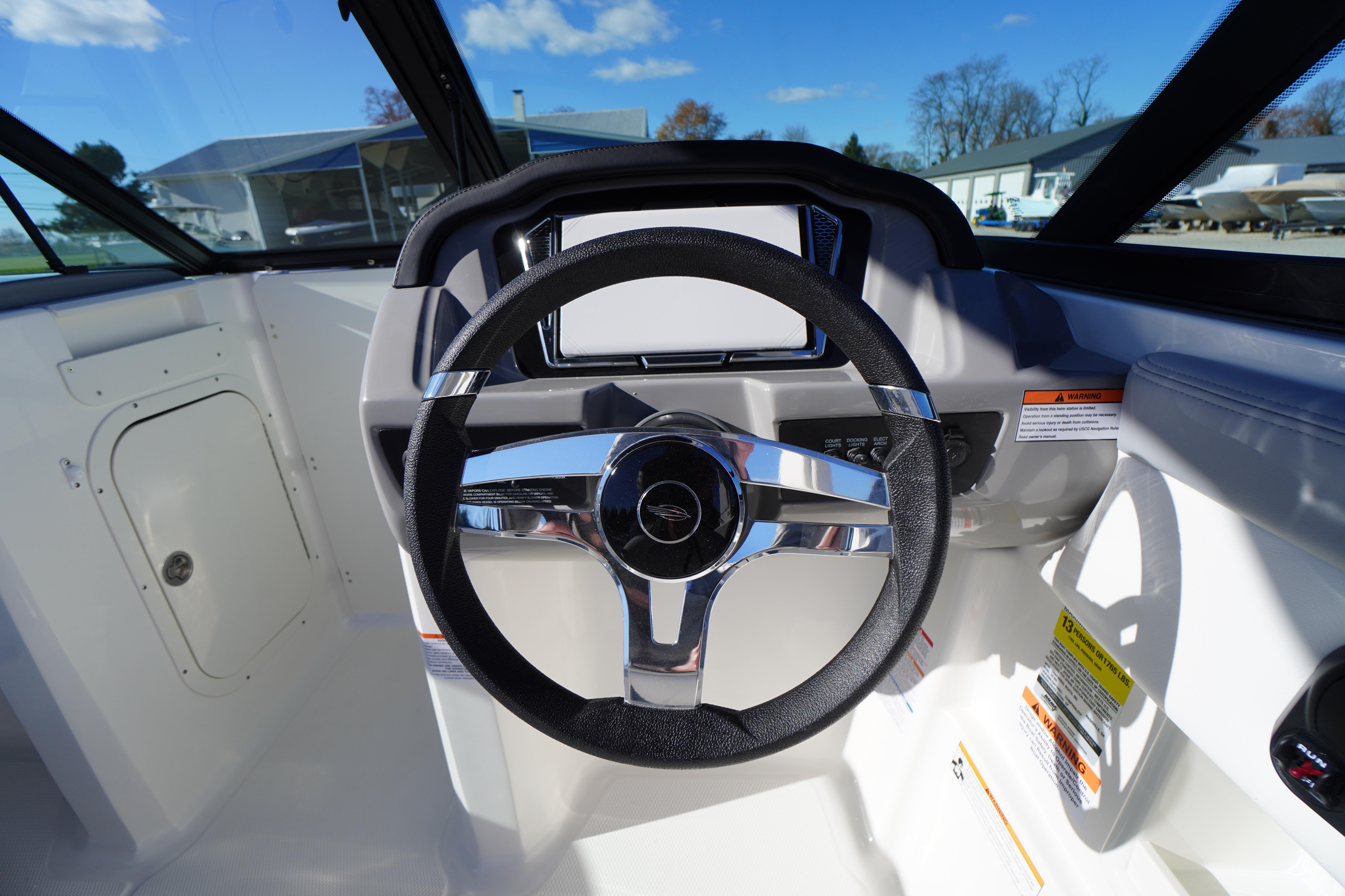 2026 Chaparral 23 SSi boat steering wheel and dashboard, showcasing modern design.