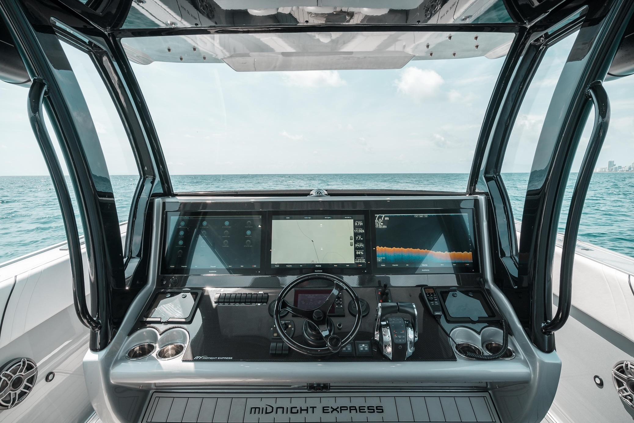 Cockpit view of 2022 Midnight Express 43 Open boat with advanced navigation displays.