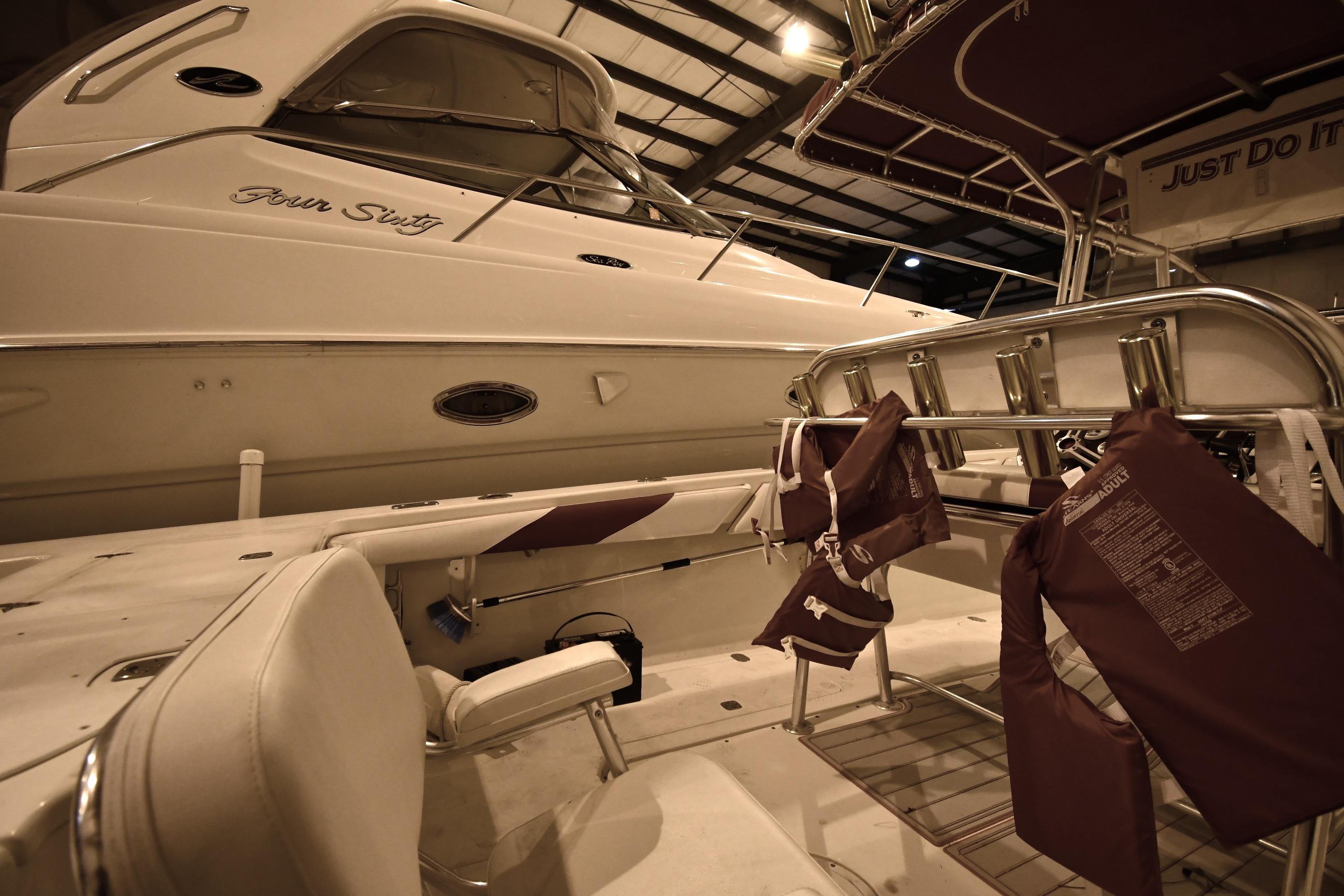 2001 Fountain 38 Center Console boat in storage, featuring life jackets and seating.