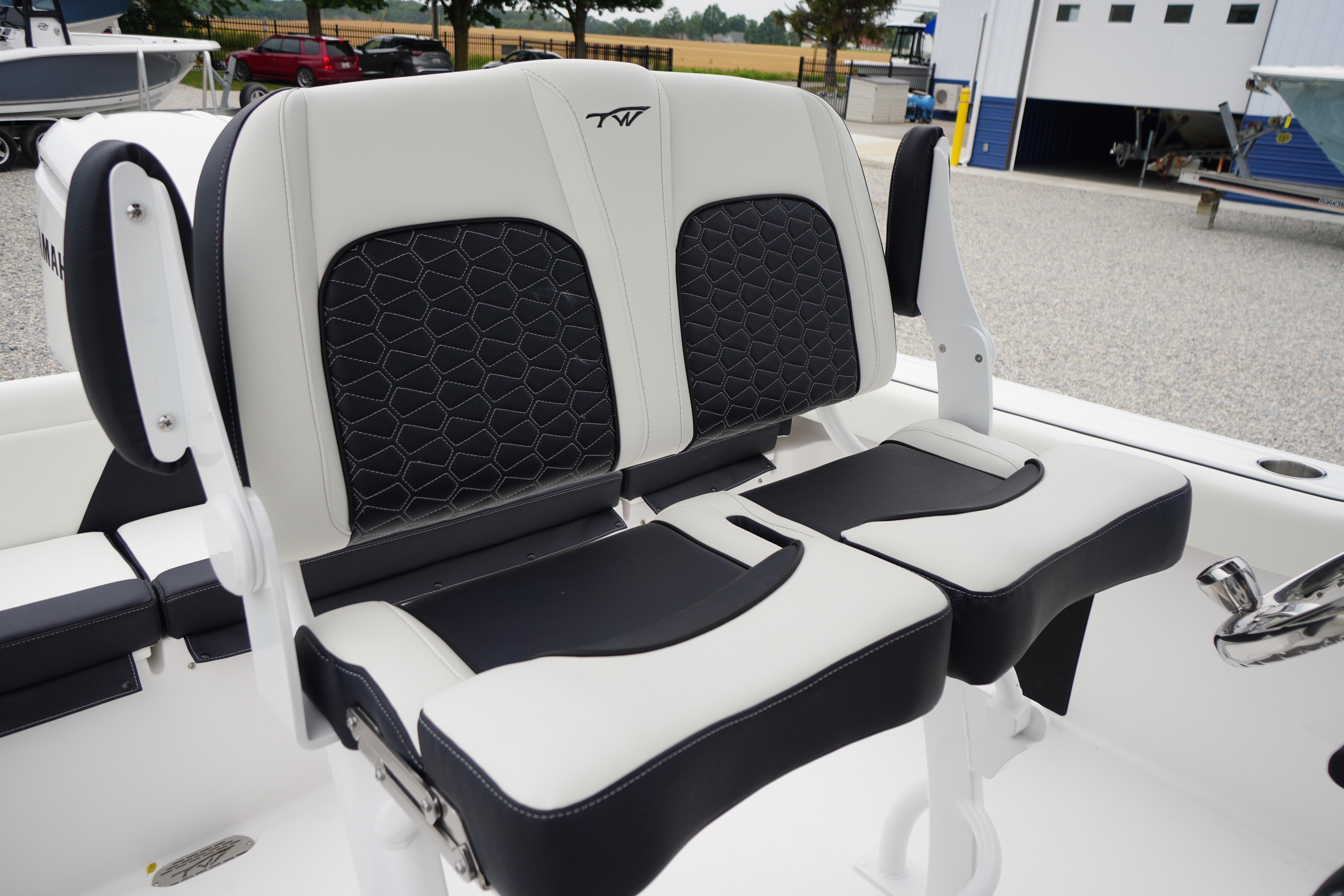 2026 Tidewater 232 SS boat seats with black and white upholstery, outdoor setting.