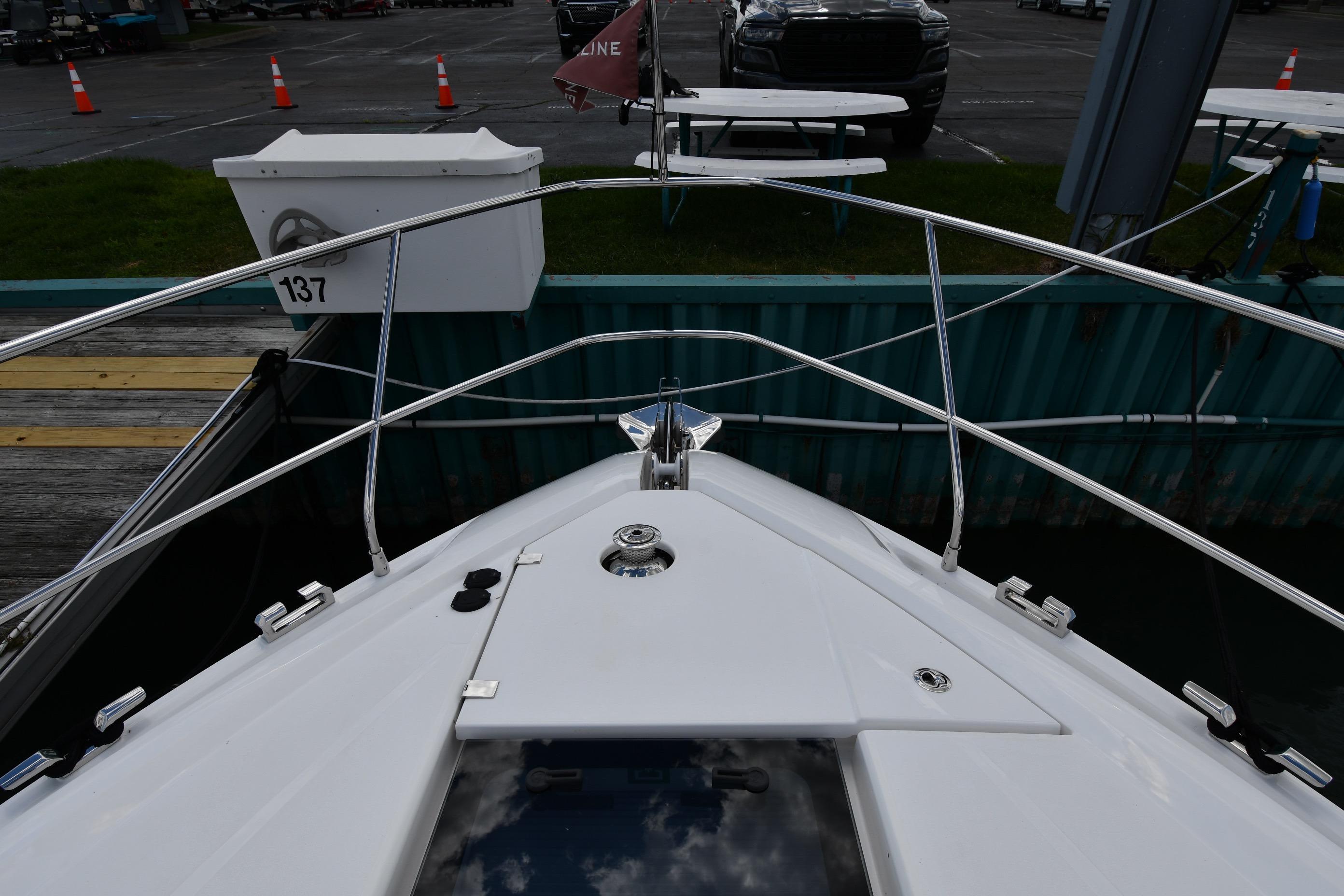 Bow view of 2024 Fairline G50 Targa yacht docked at marina.