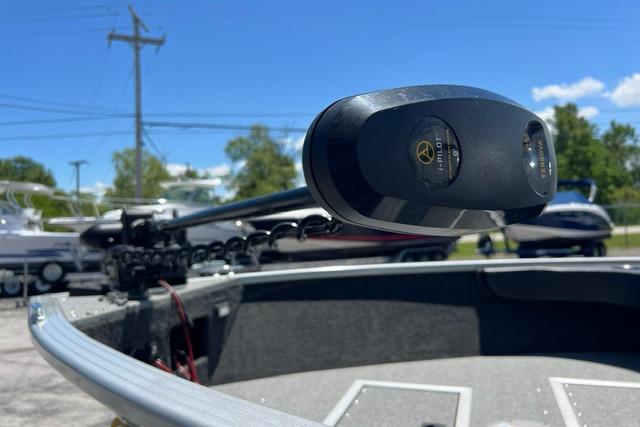 2023 Starweld Fusion 18 DC boat with advanced trolling motor, parked outdoors.