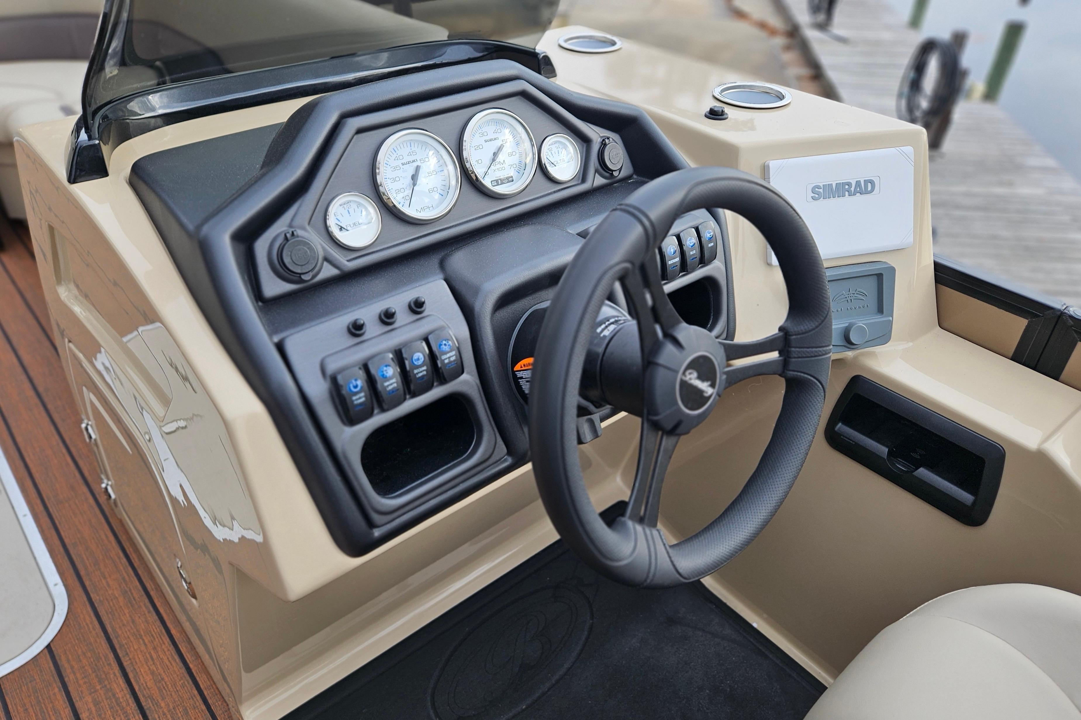 2026 Bentley Pontoons Legacy 243 Cruise dashboard with steering wheel and control panel.