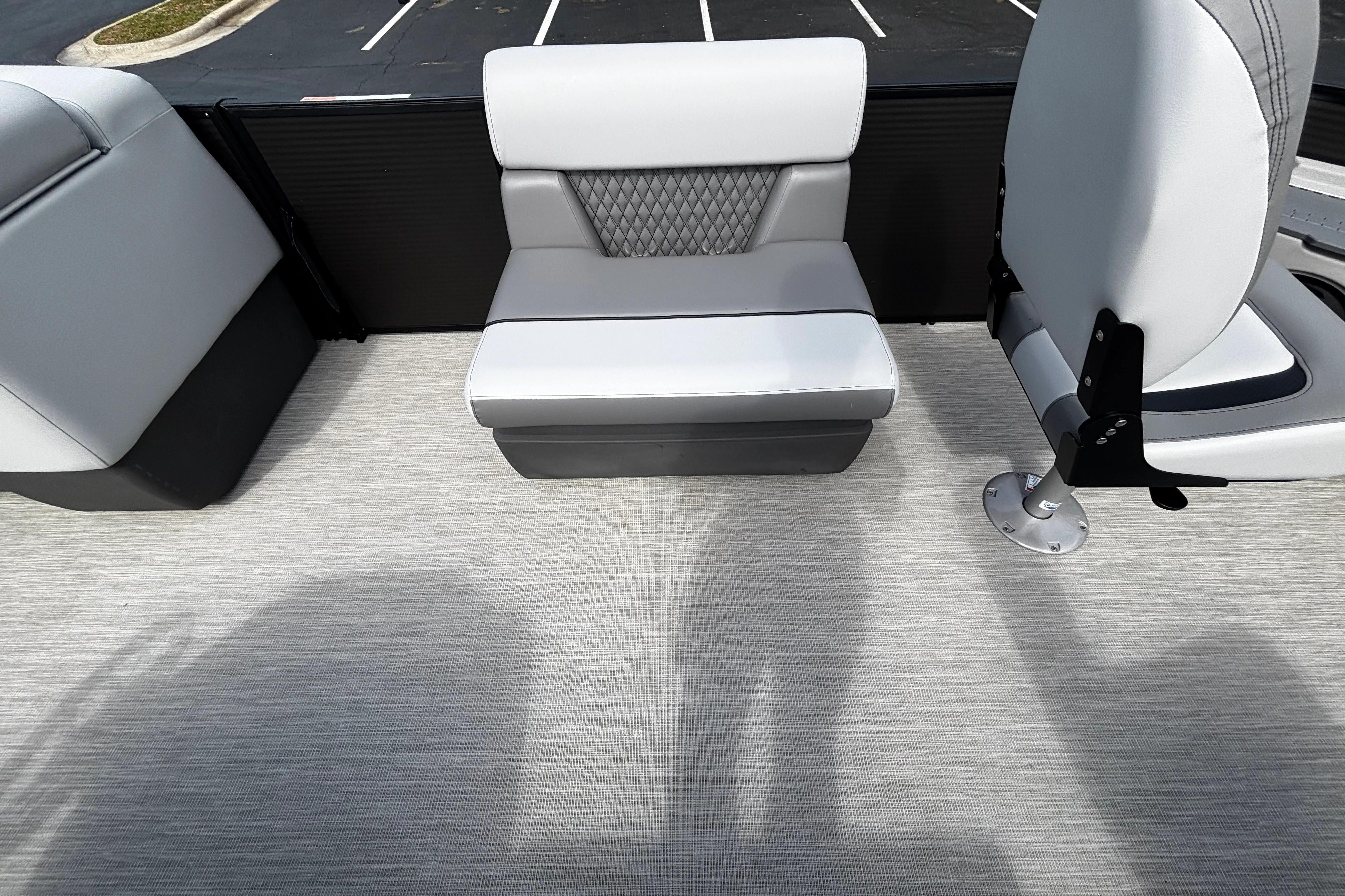 2026 Princecraft Sportfisher 21-2S boat interior with gray seating and textured flooring.