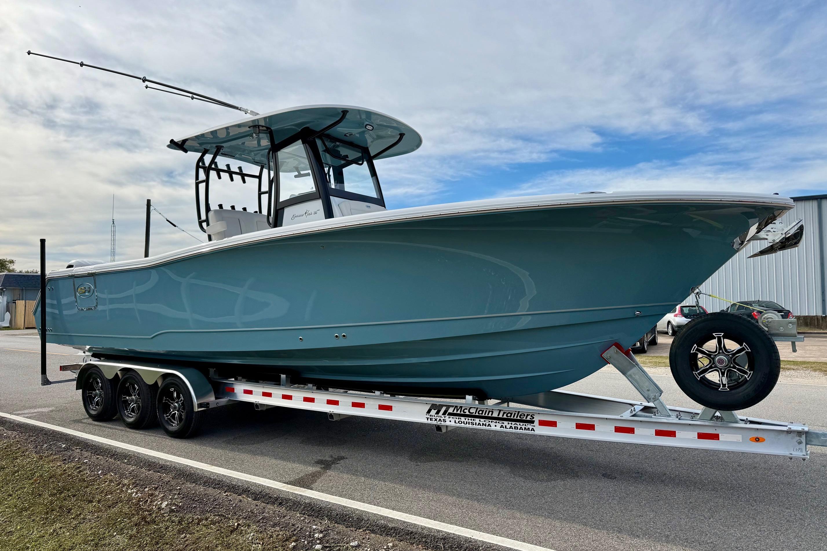 2026 Sea Hunt Gamefish 30 Coffin Box boat on trailer, parked outdoors.