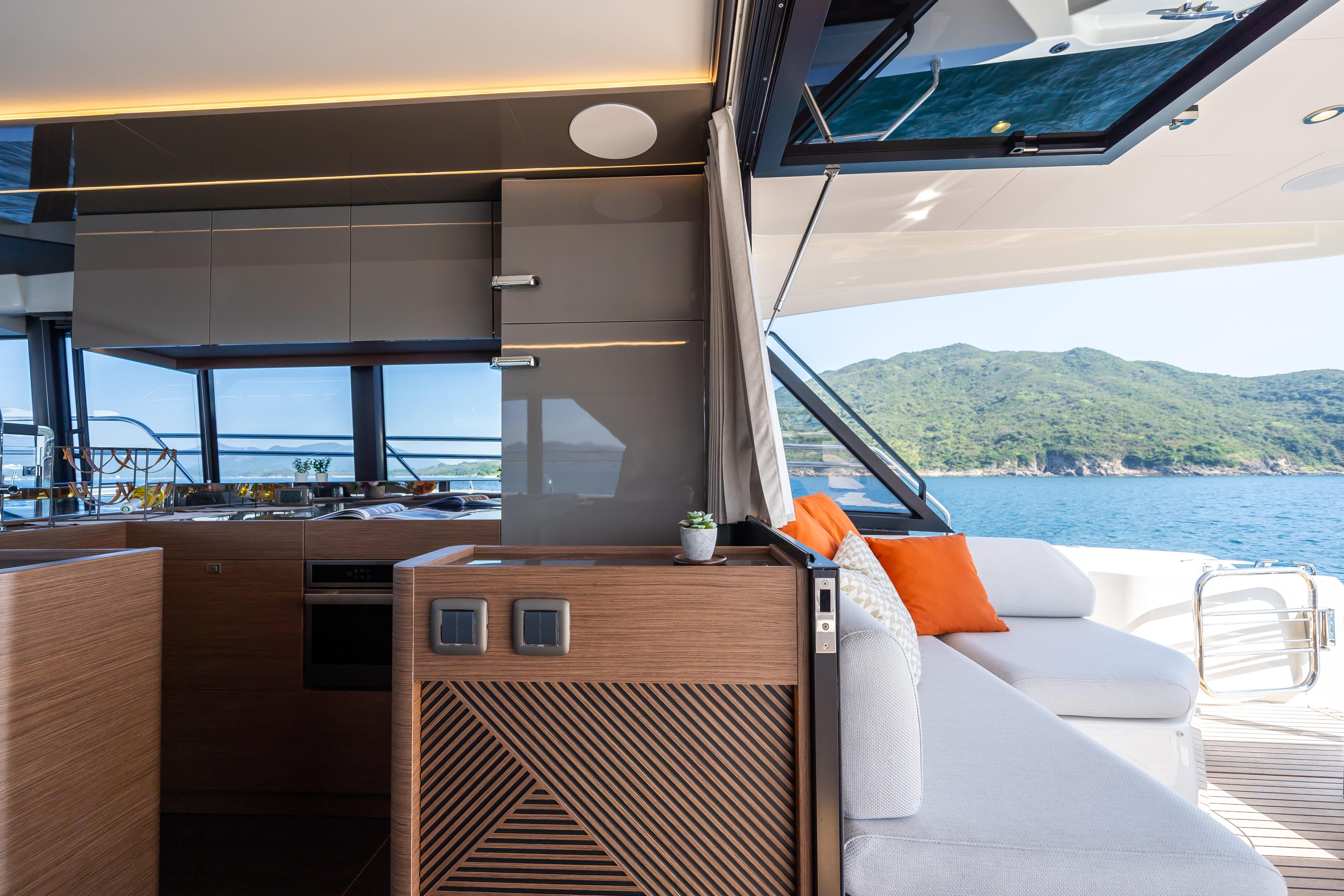 Luxurious interior of 2025 Prestige M48 yacht with ocean view and modern design.