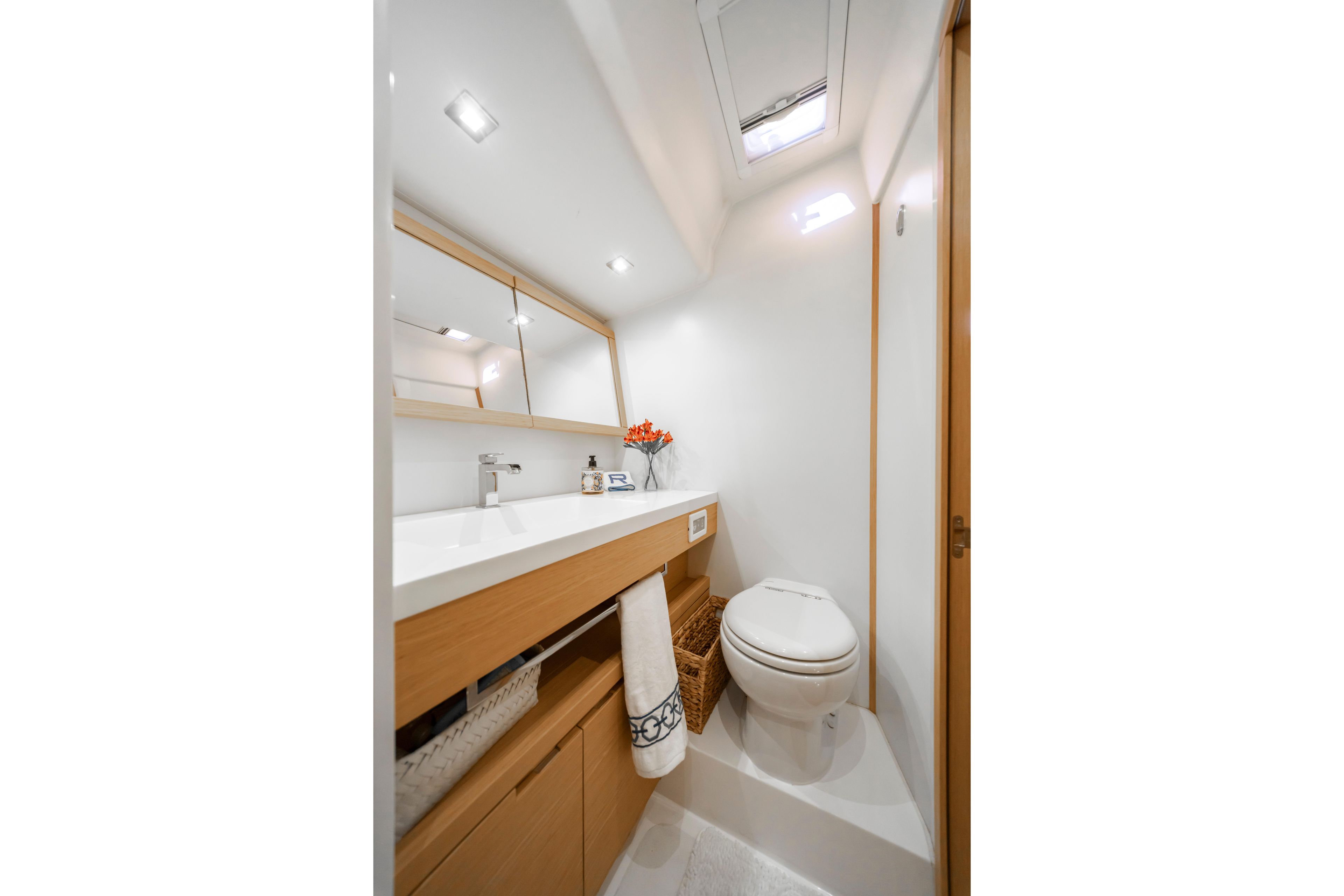 Luxurious bathroom interior of 2016 Grand Soleil 58 yacht, featuring modern fixtures and elegant design.