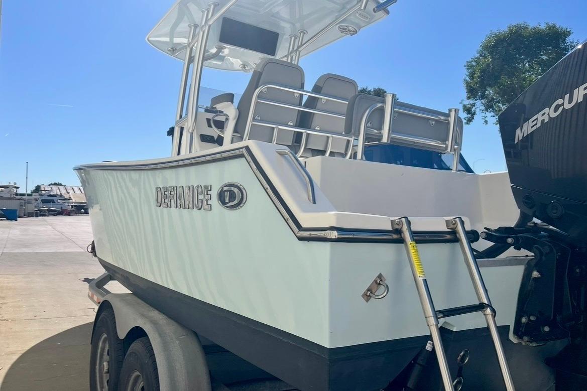 2025 Defiance Catalina 240 boat on trailer, featuring a Mercury outboard motor.