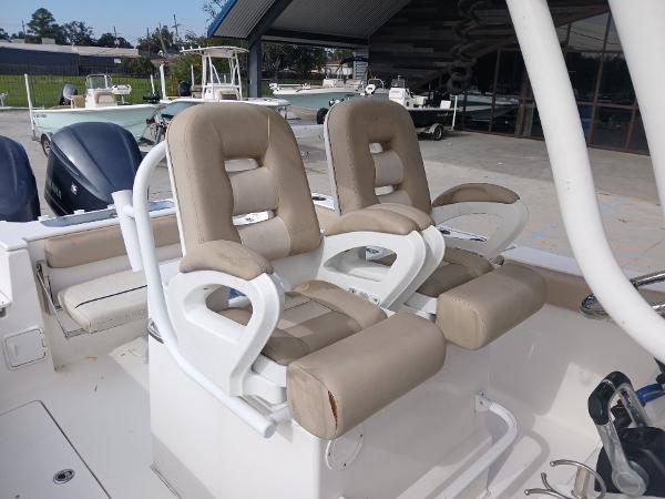2015 Sea Fox 286 Commander boat seats, beige upholstery, docked in marina.